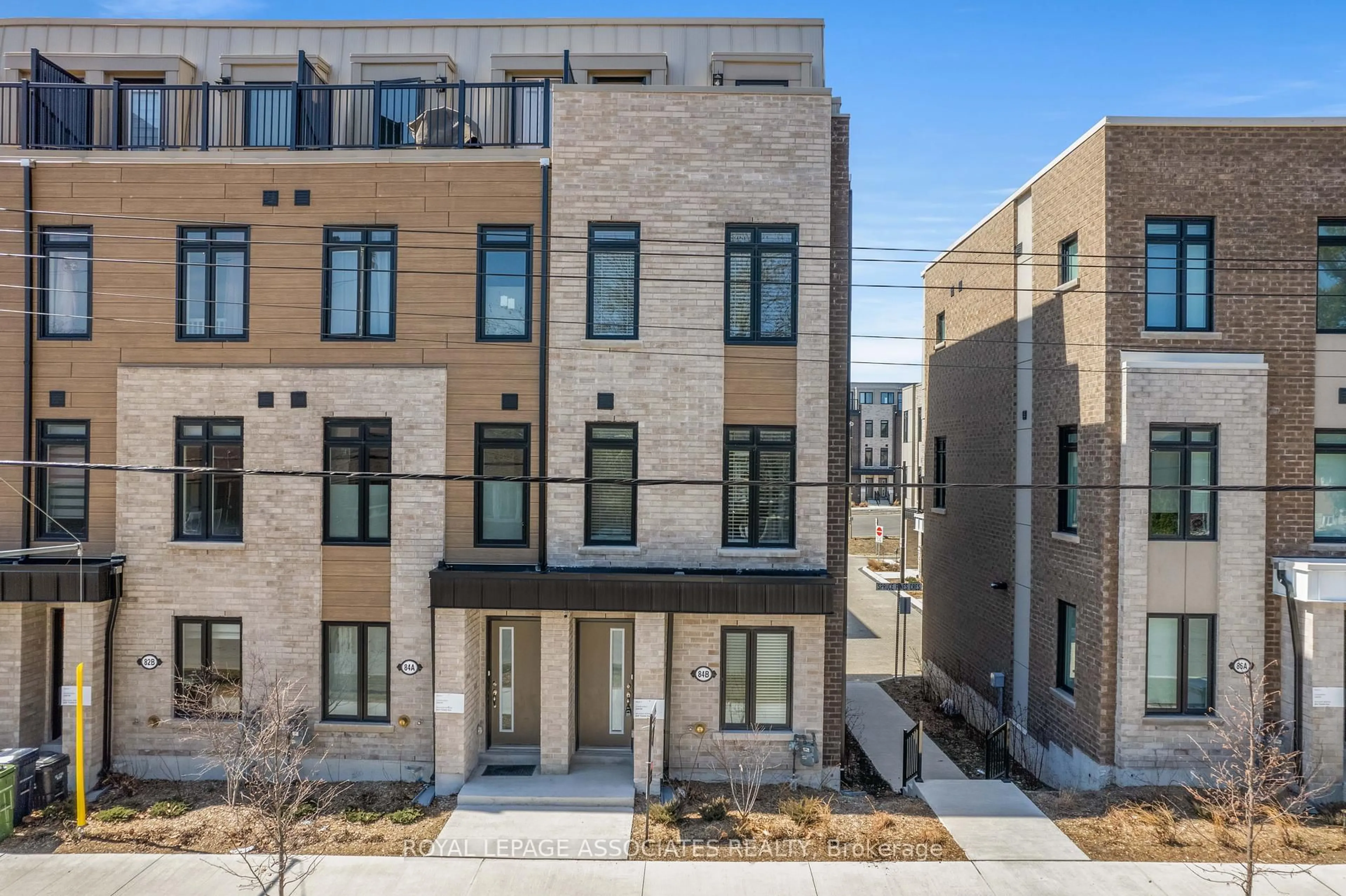 Home with brick exterior material, street for 84B Tisdale Ave, Toronto Ontario M4A 0A9