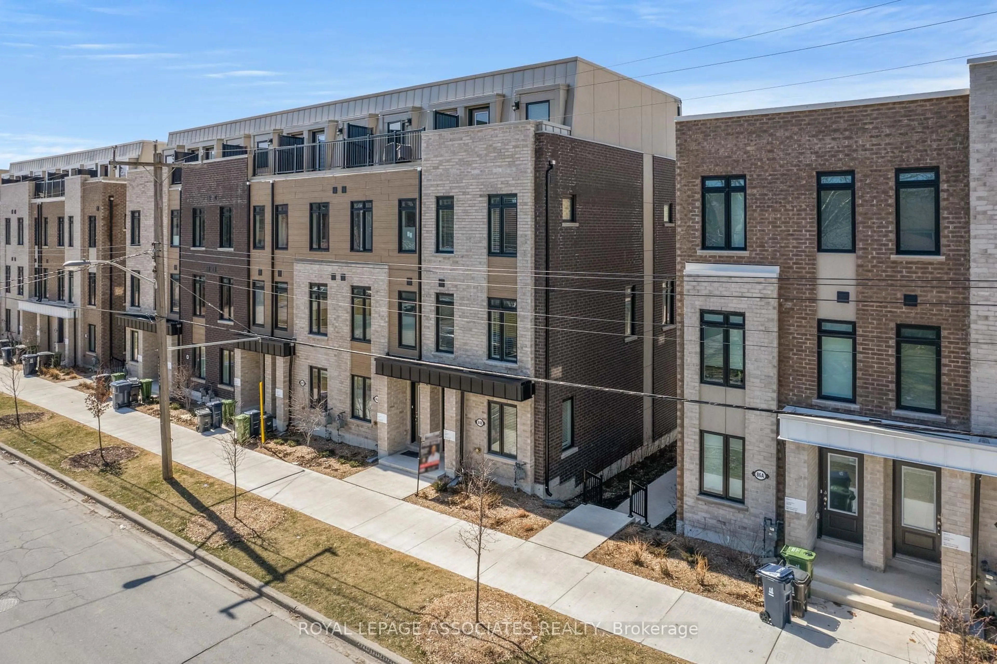 A pic from outside/outdoor area/front of a property/back of a property/a pic from drone, street for 84B Tisdale Ave, Toronto Ontario M4A 0A9