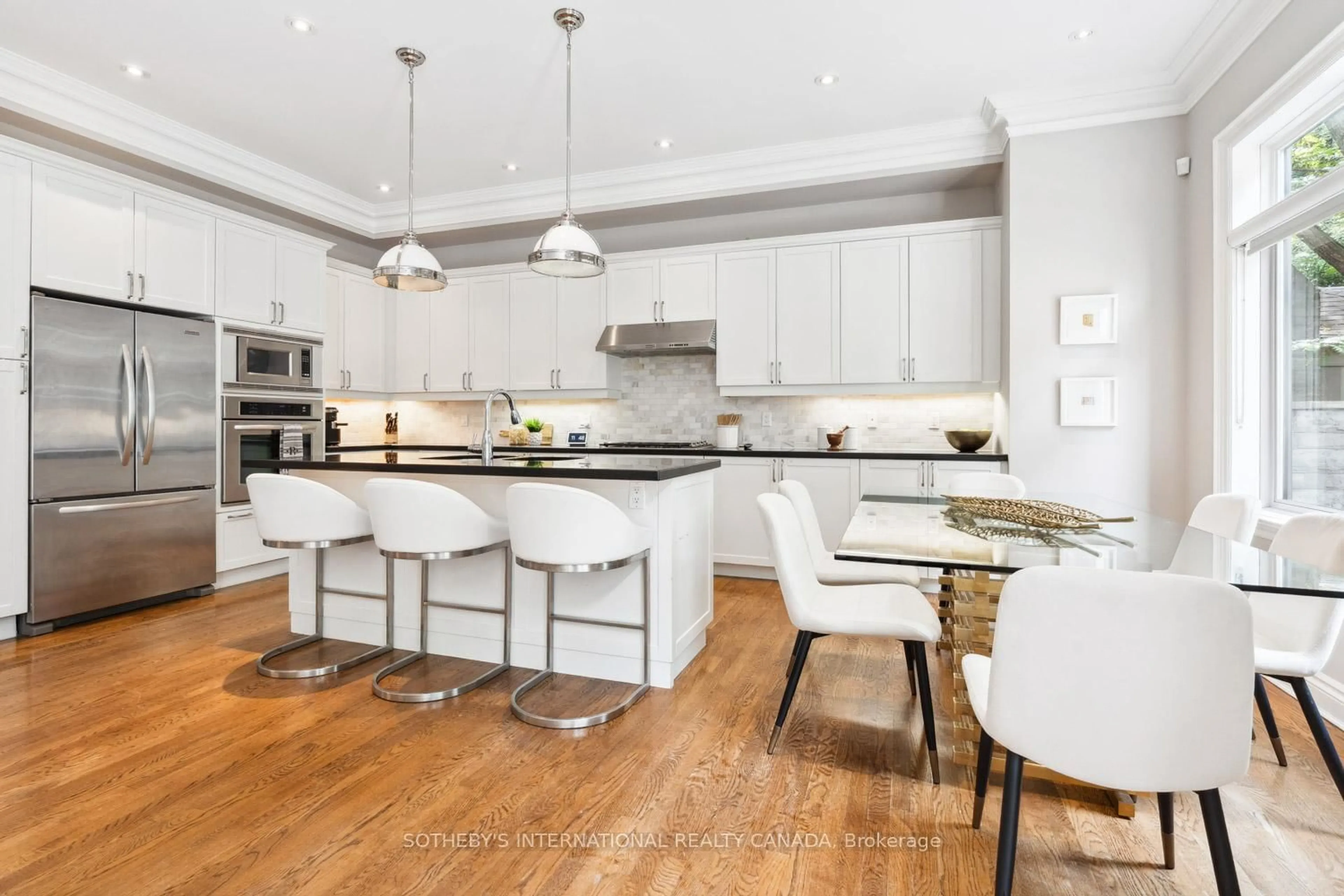 Open concept kitchen, wood/laminate floor for 177 Dewbourne Ave, Toronto Ontario M6C 1Z6