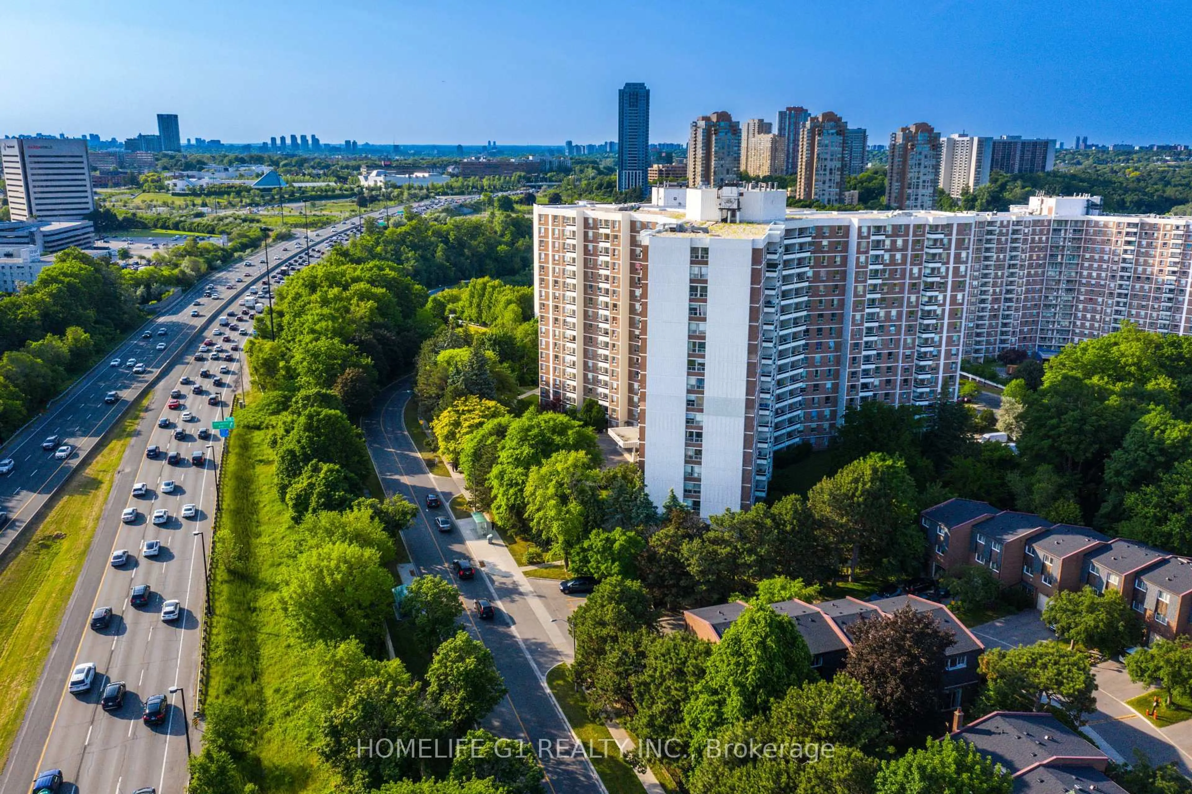 A pic from outside/outdoor area/front of a property/back of a property/a pic from drone, city buildings view from balcony for 5 Shady Gfwy #706, Toronto Ontario M3C 3A5