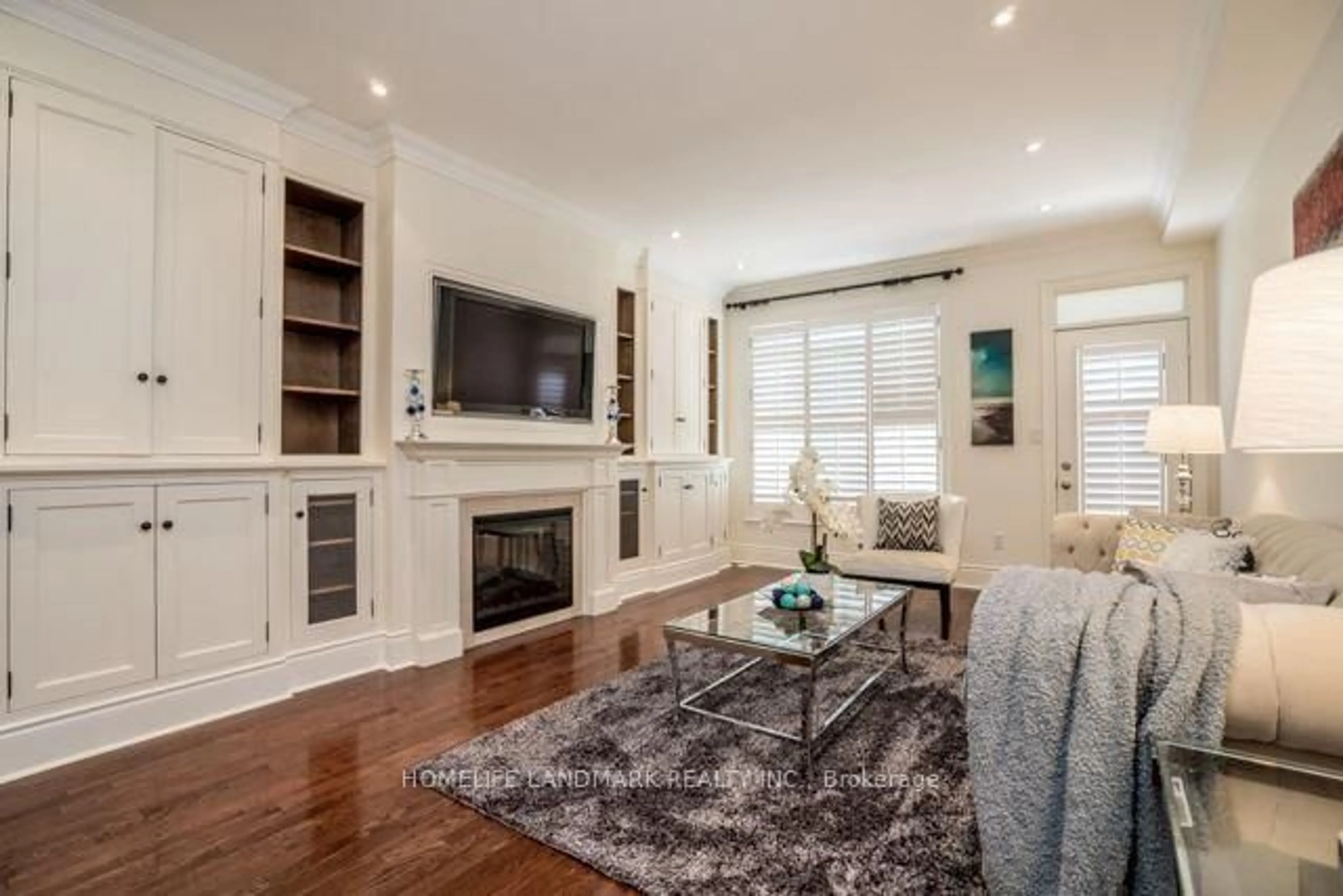 Living room with furniture, wood/laminate floor for 2 Espana Lane, Toronto Ontario M2N 7K8