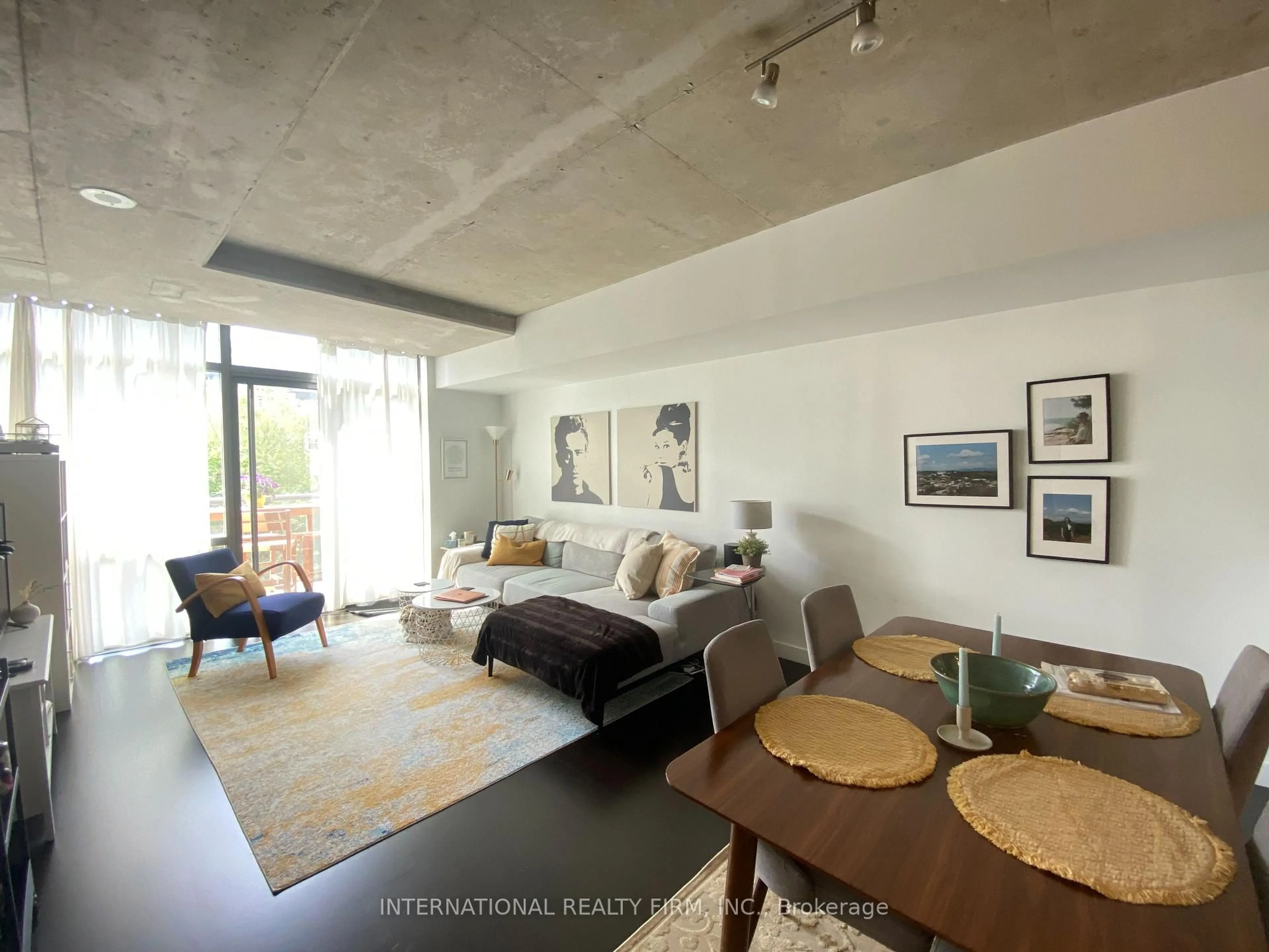 Living room with furniture, cement floor for 55 Stewart St #635, Toronto Ontario M5V 2V1