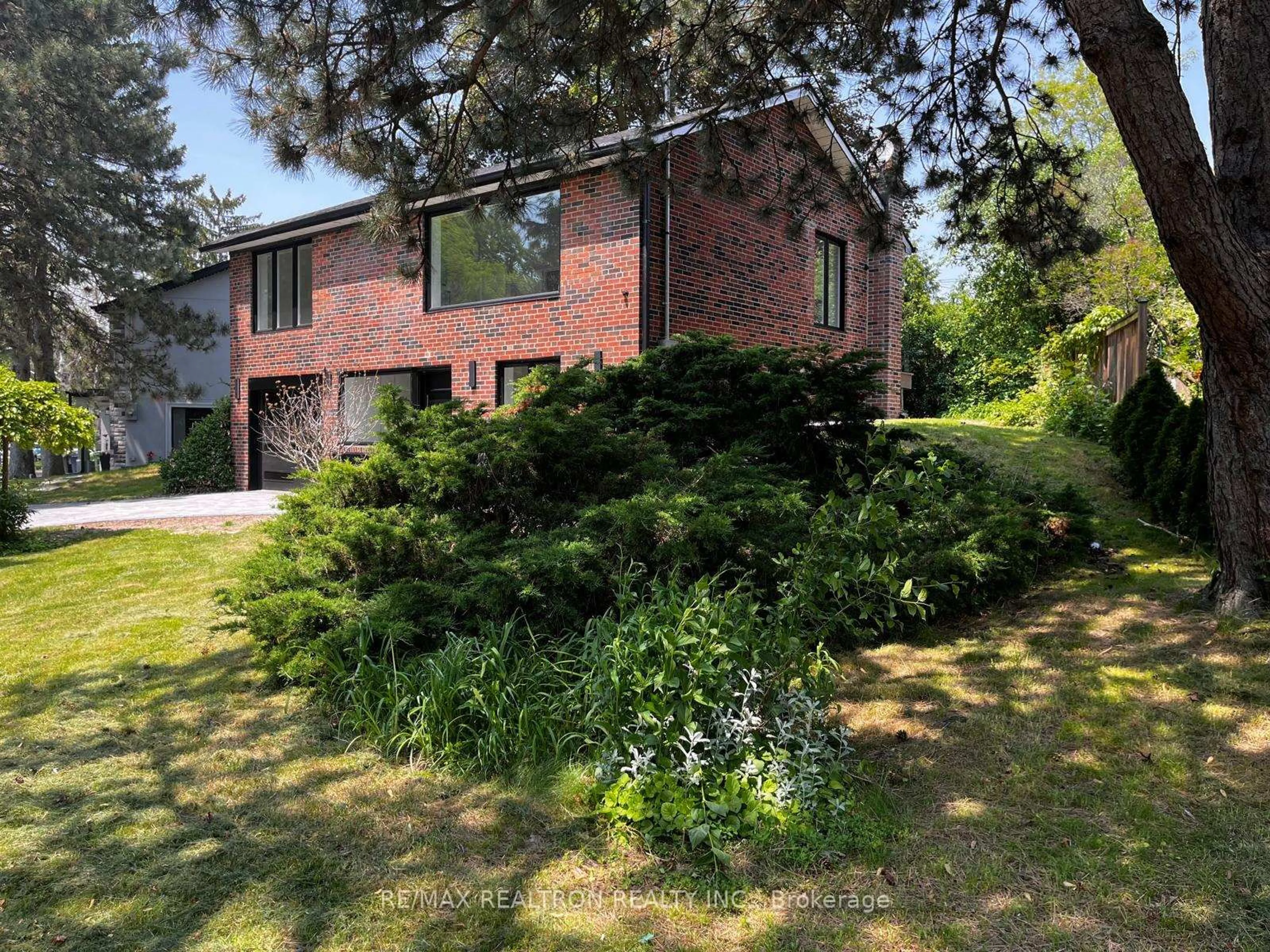 A pic from outside/outdoor area/front of a property/back of a property/a pic from drone, forest/trees view for 186 Sweeney Dr, Toronto Ontario M4A 1V4