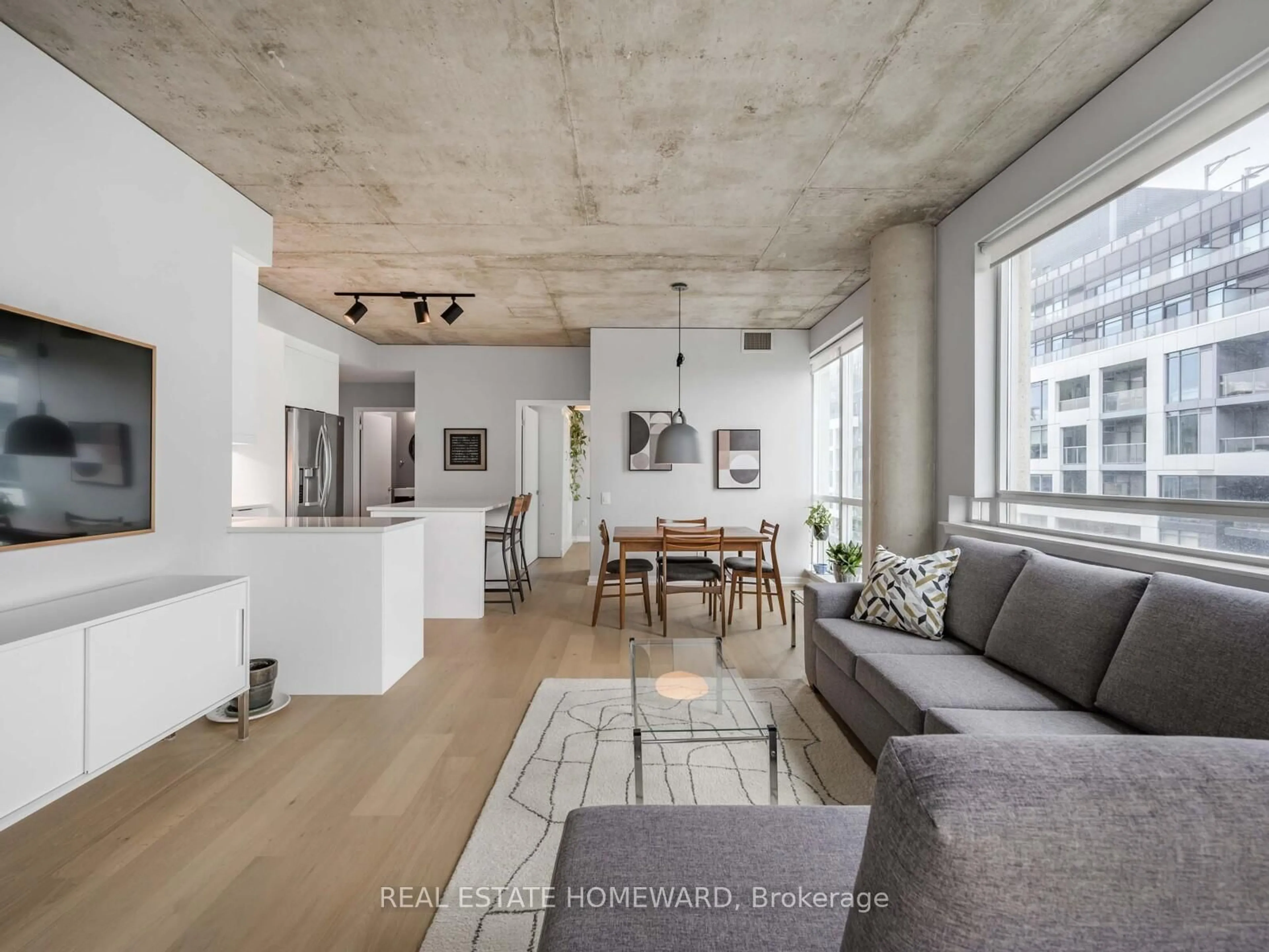 Living room with furniture, cement floor for 38 Niagara St #706, Toronto Ontario M5V 3X1
