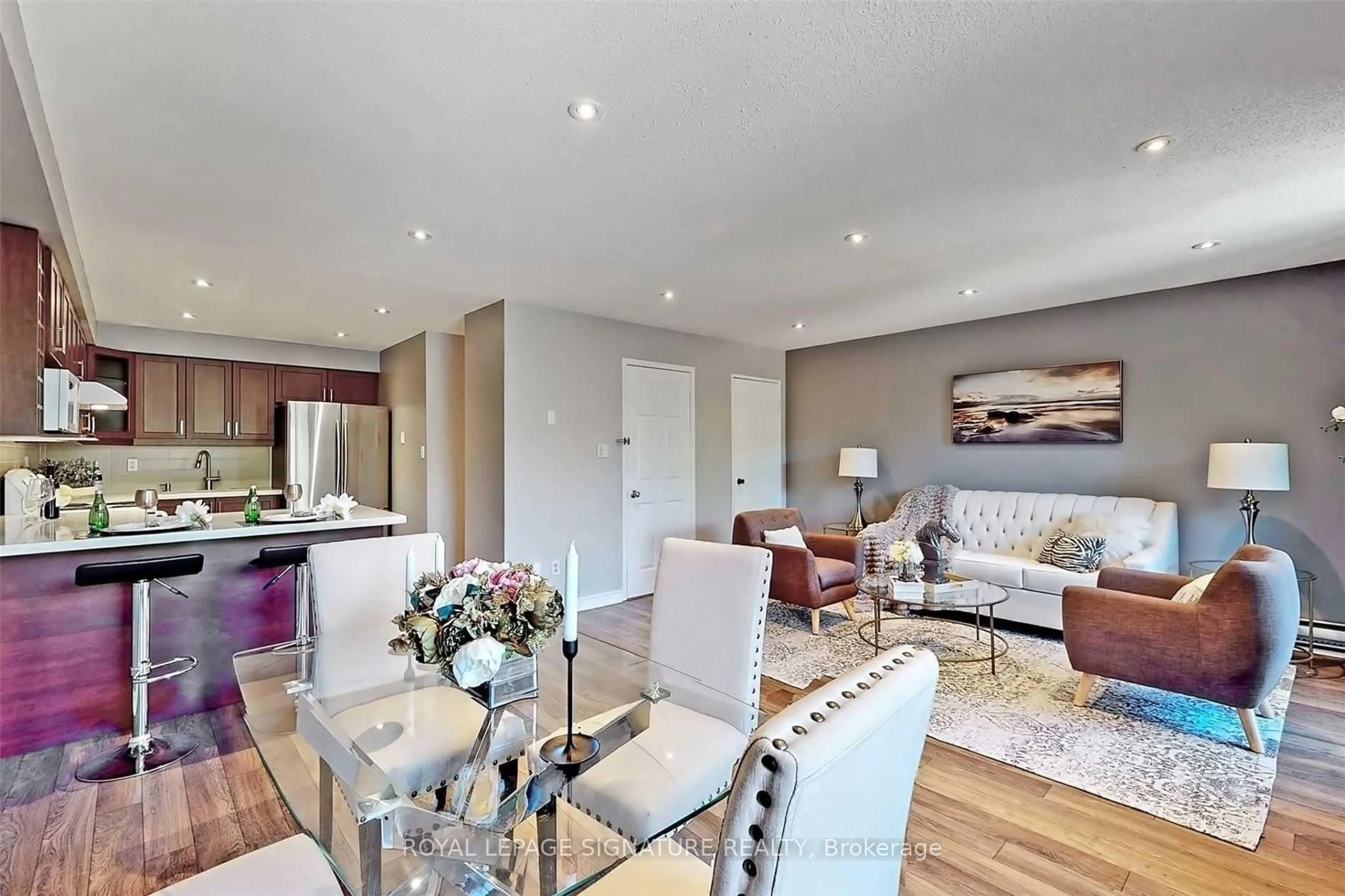 Living room with furniture, wood/laminate floor for 20 Moonstone Bywy #190, Toronto Ontario M2H 3J4