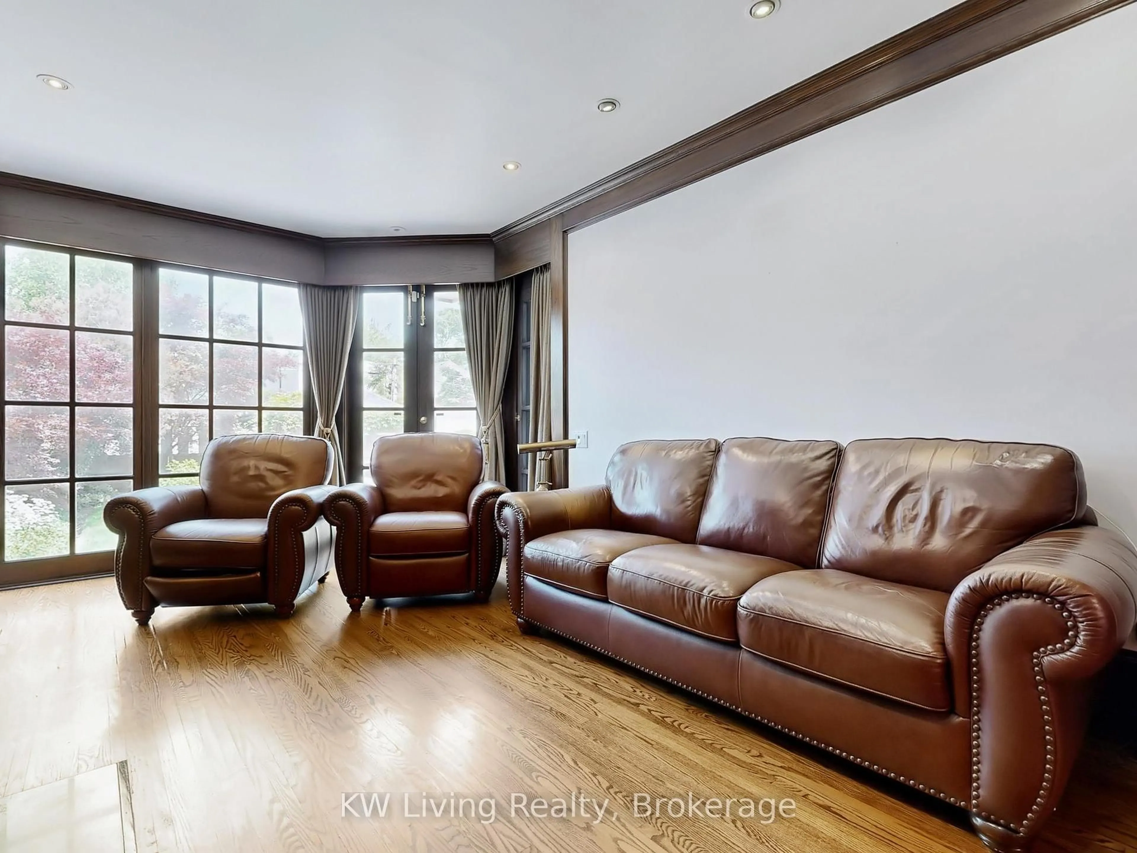 Living room with furniture, wood/laminate floor for 26 Wilberton Rd, Toronto Ontario M4V 1Z3