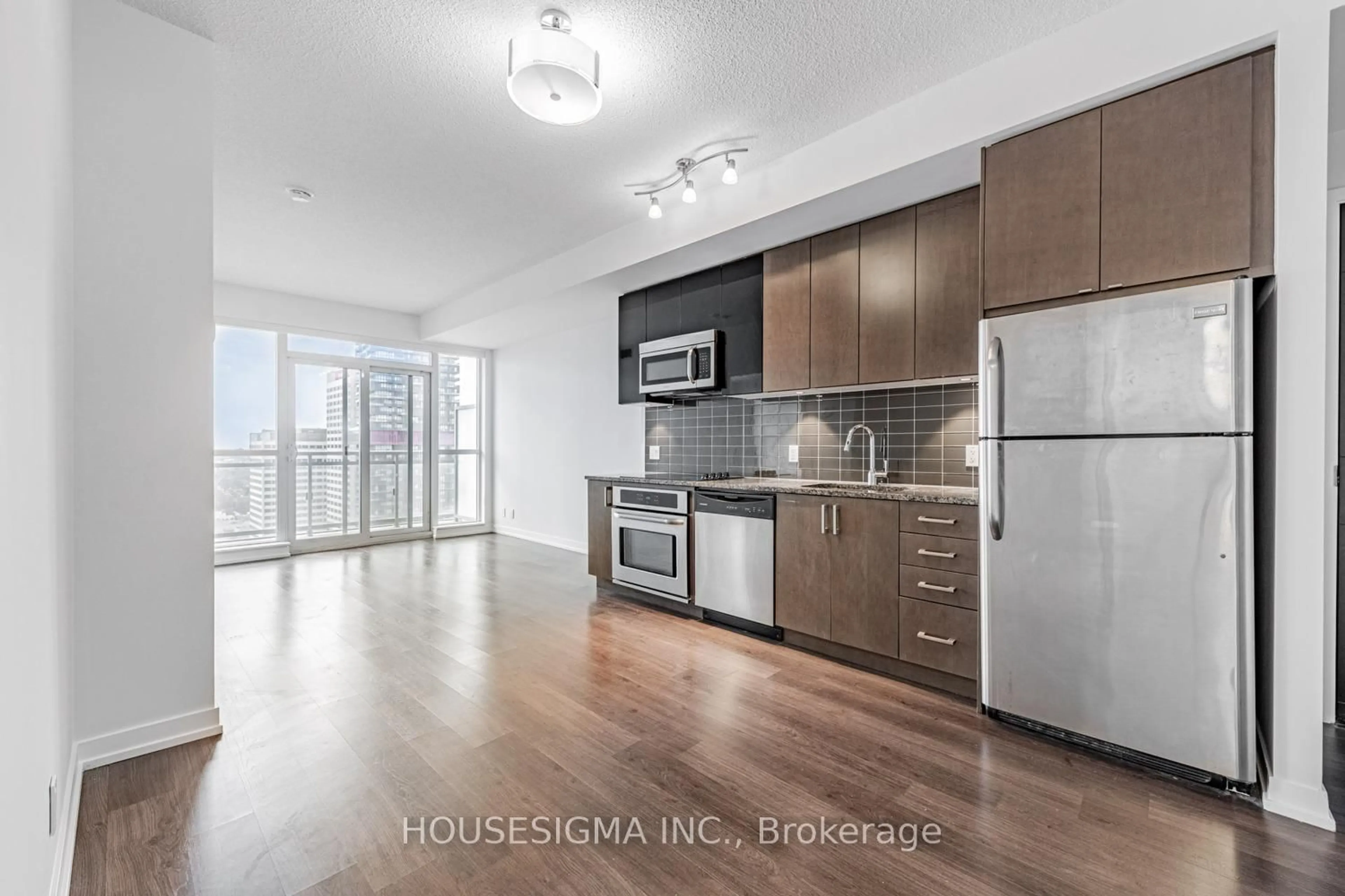 Open concept kitchen, wood/laminate floor for 89 Dunfield Ave #2701, Toronto Ontario M4S 0A4