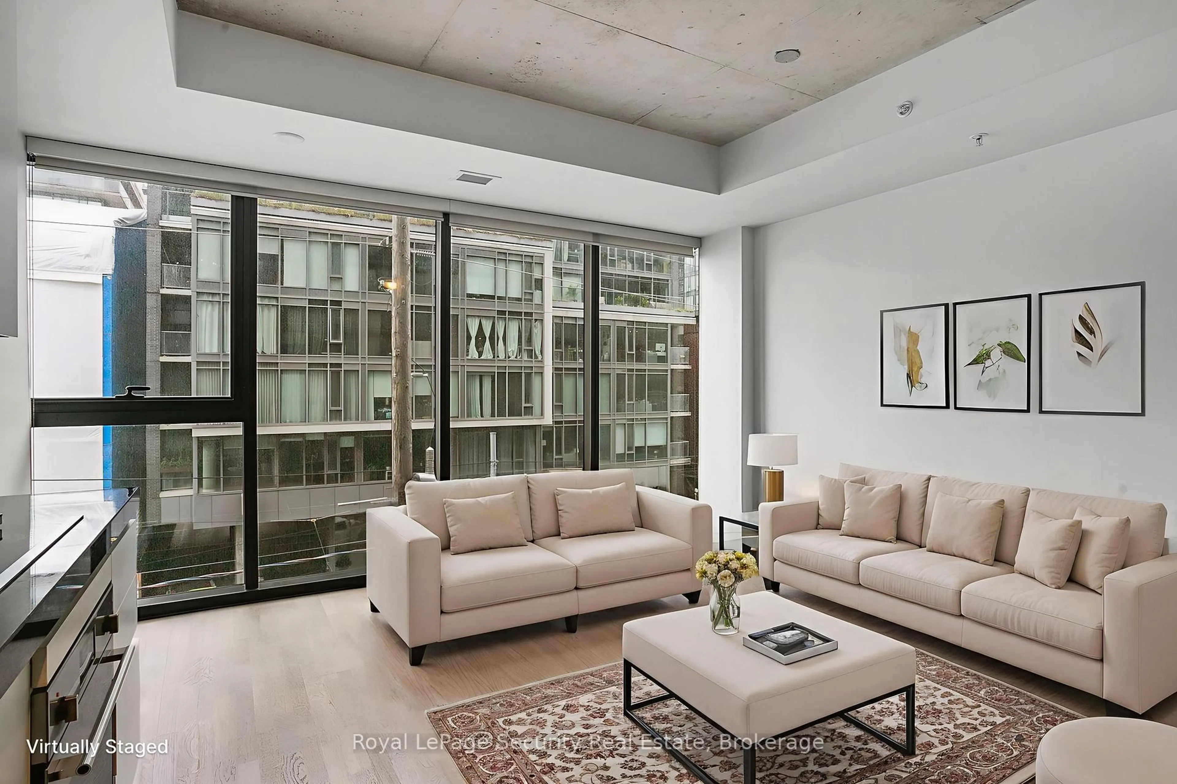 Living room with furniture, cement floor for 629 King St #320, Toronto Ontario M5V 1M5