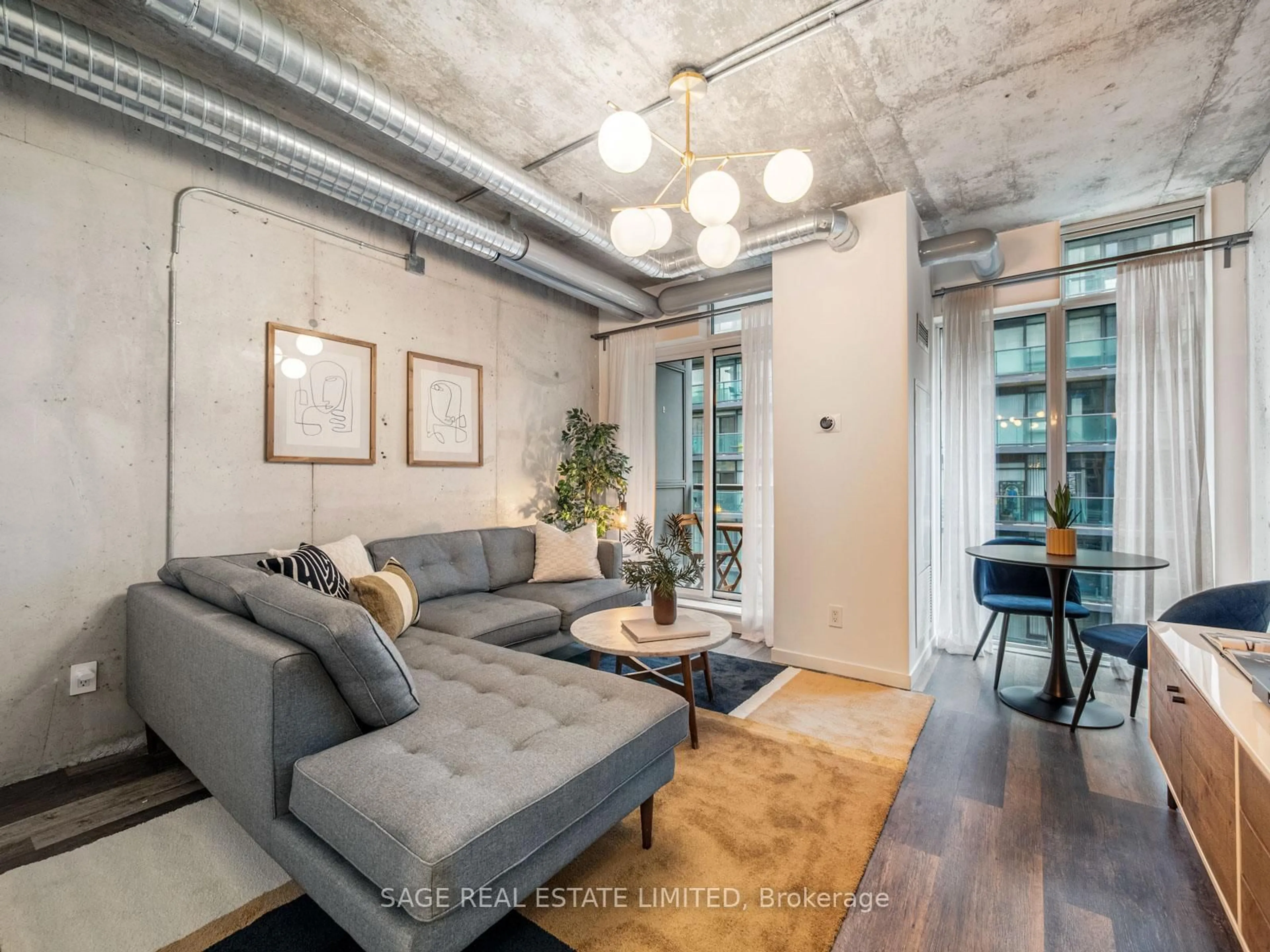 Living room with furniture, cement floor for 150 Sudbury St #1208, Toronto Ontario M6J 3S8