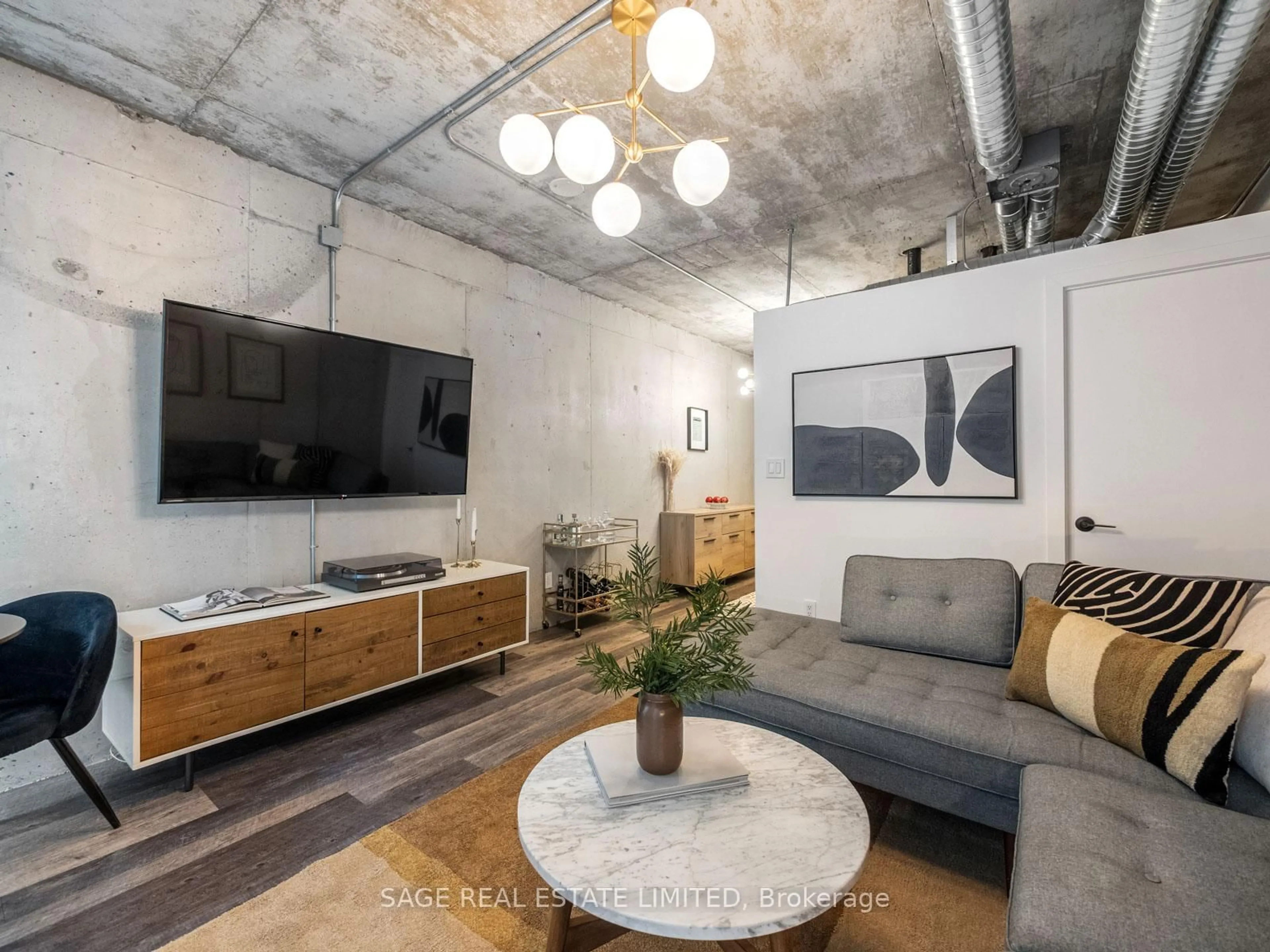 Living room with furniture, cement floor for 150 Sudbury St #1208, Toronto Ontario M6J 3S8