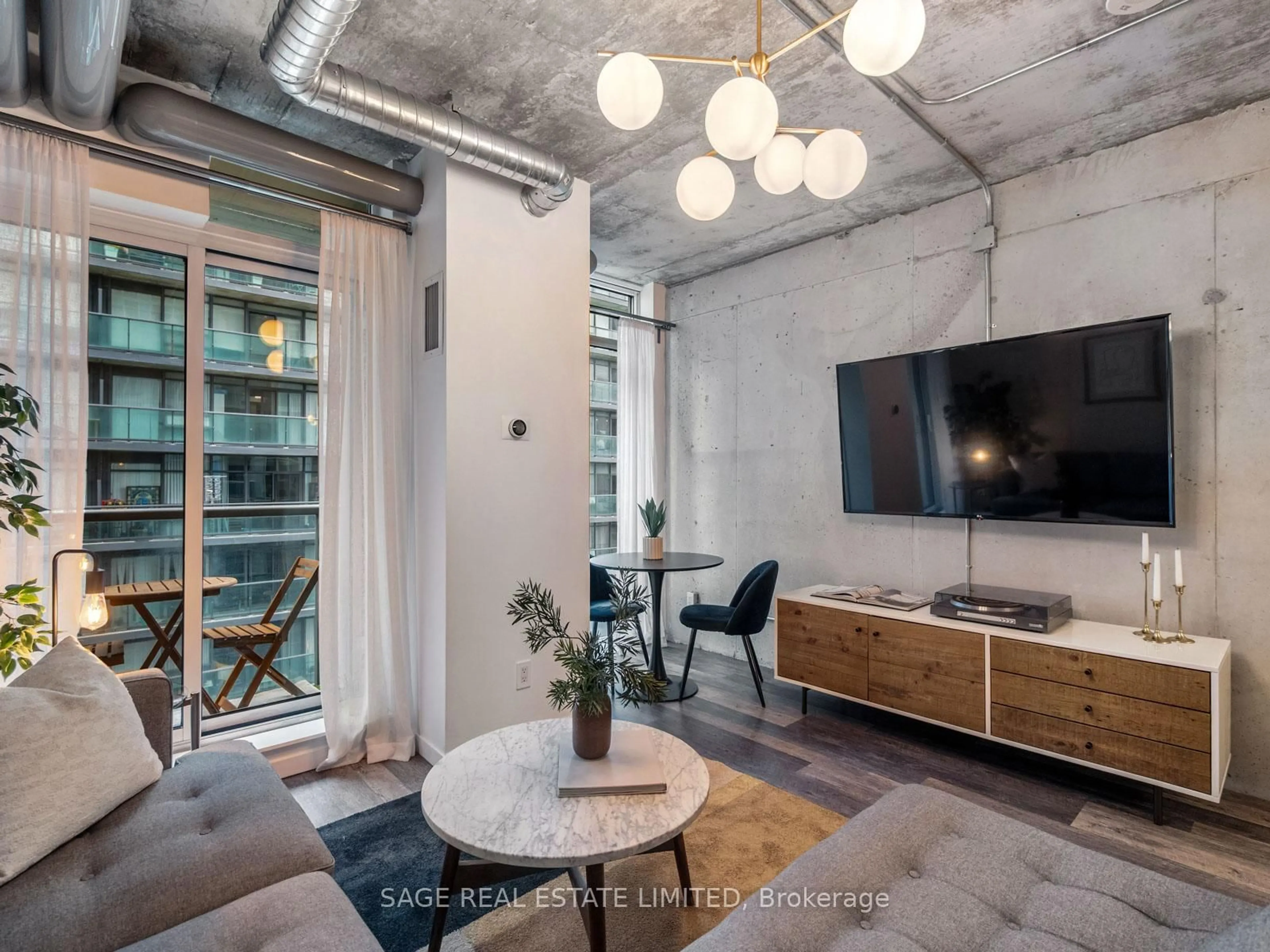 Living room with furniture, cement floor for 150 Sudbury St #1208, Toronto Ontario M6J 3S8
