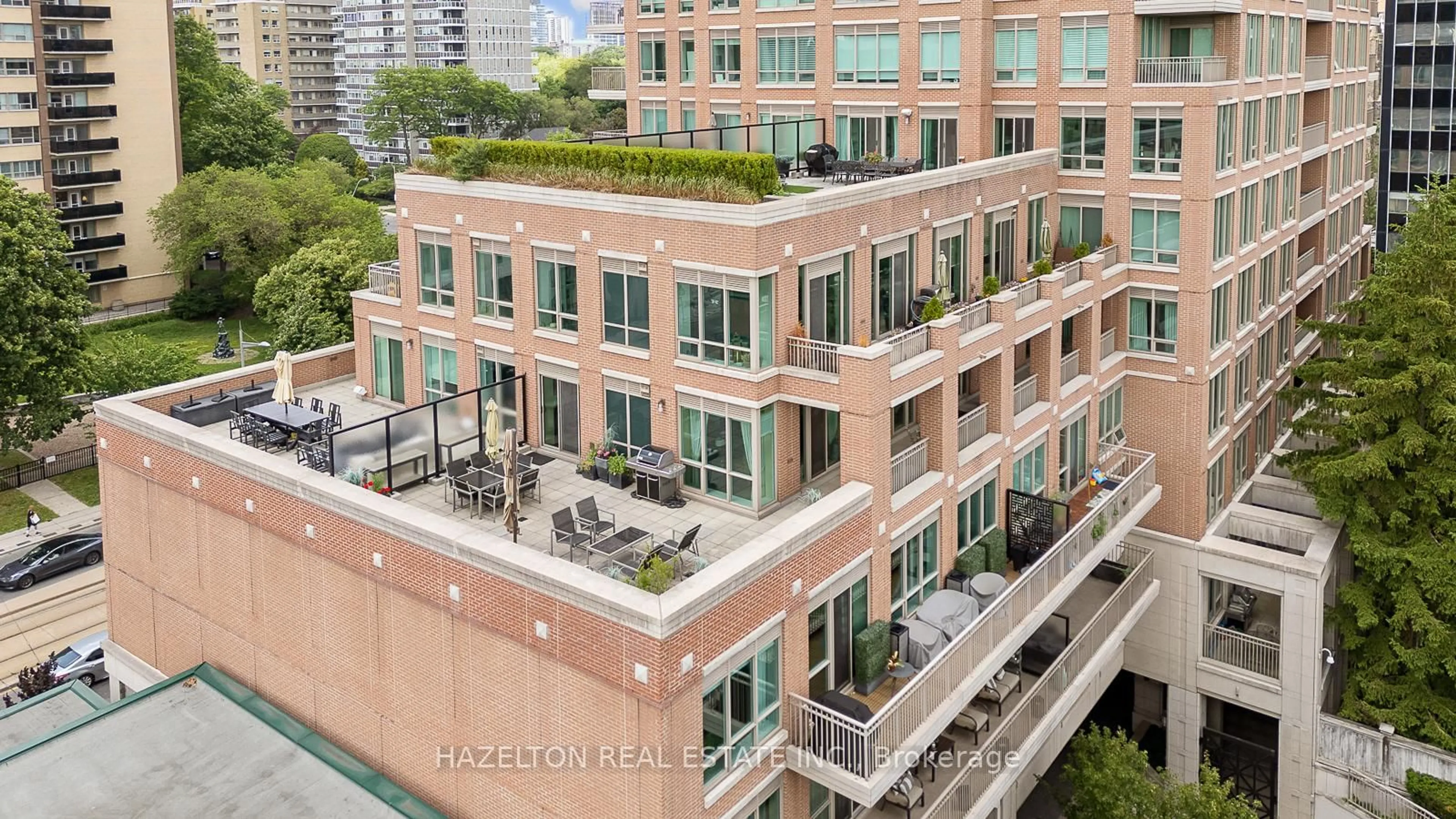Patio, city buildings view from balcony for 155 St Clair Ave #506, Toronto Ontario M4V 0A1