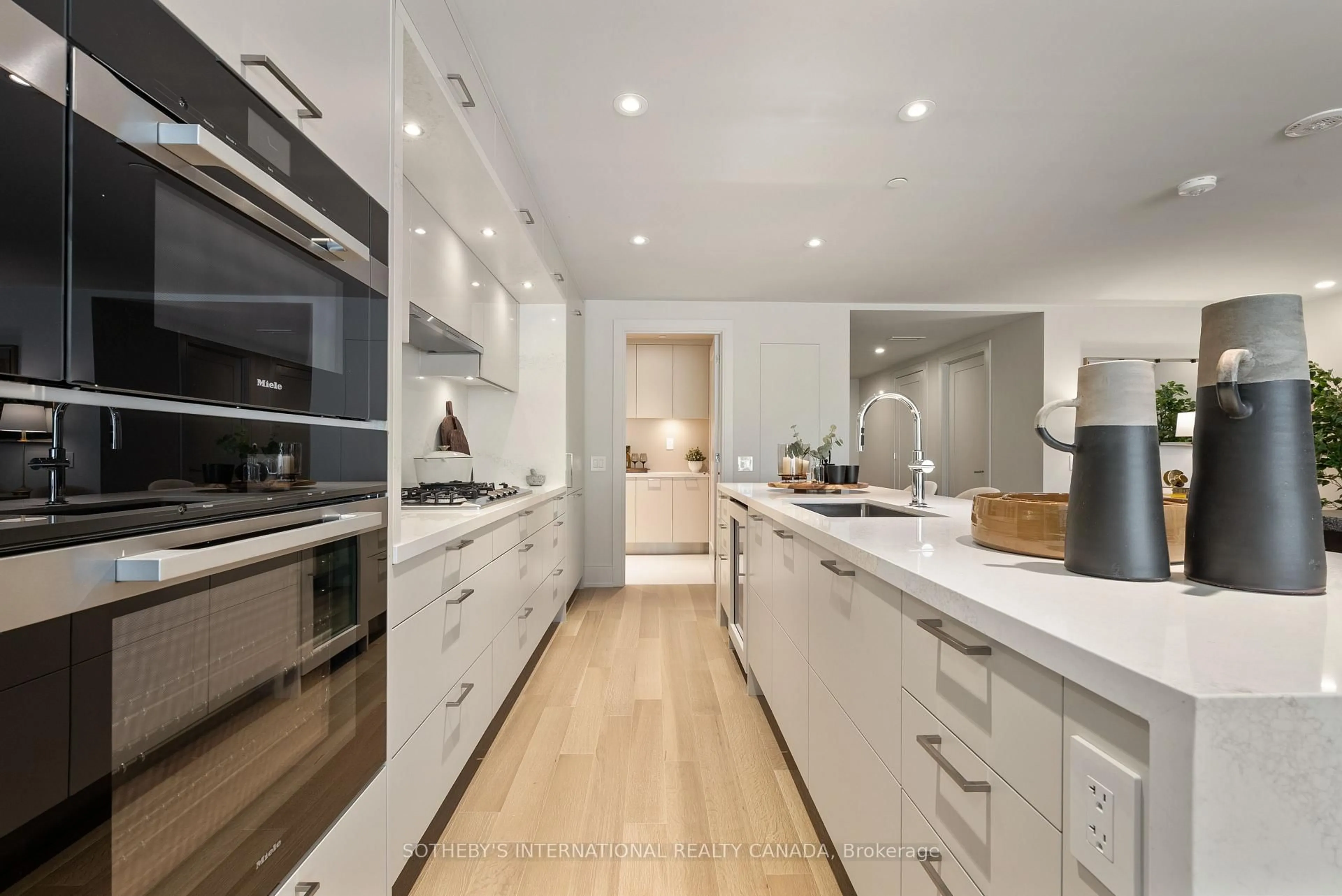 Contemporary kitchen, wood/laminate floor for 155 Merchants' Wharf #217, Toronto Ontario M5A 0Y4