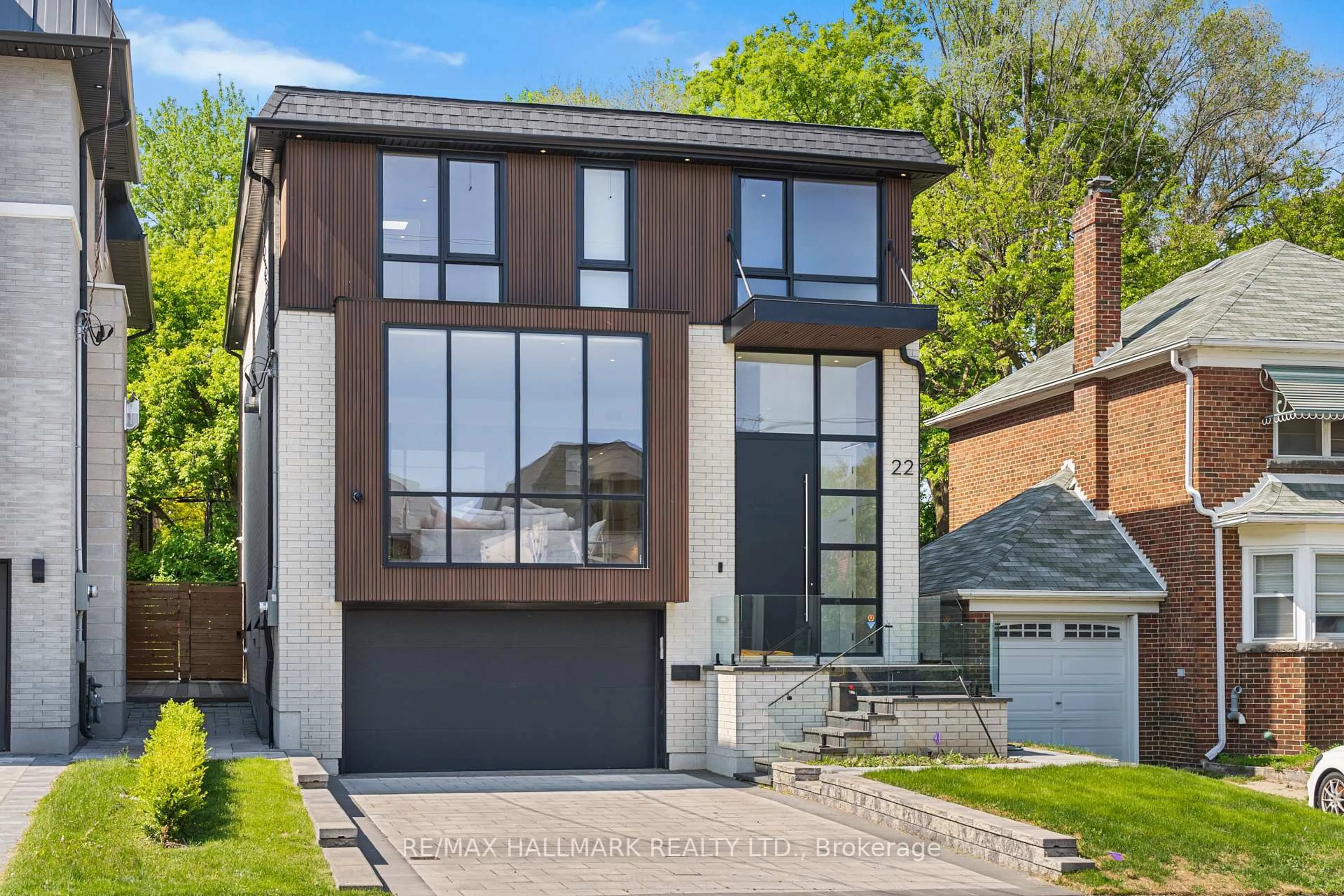 Home with brick exterior material, street for 22 Divadale Dr, Toronto Ontario M4G 2N9