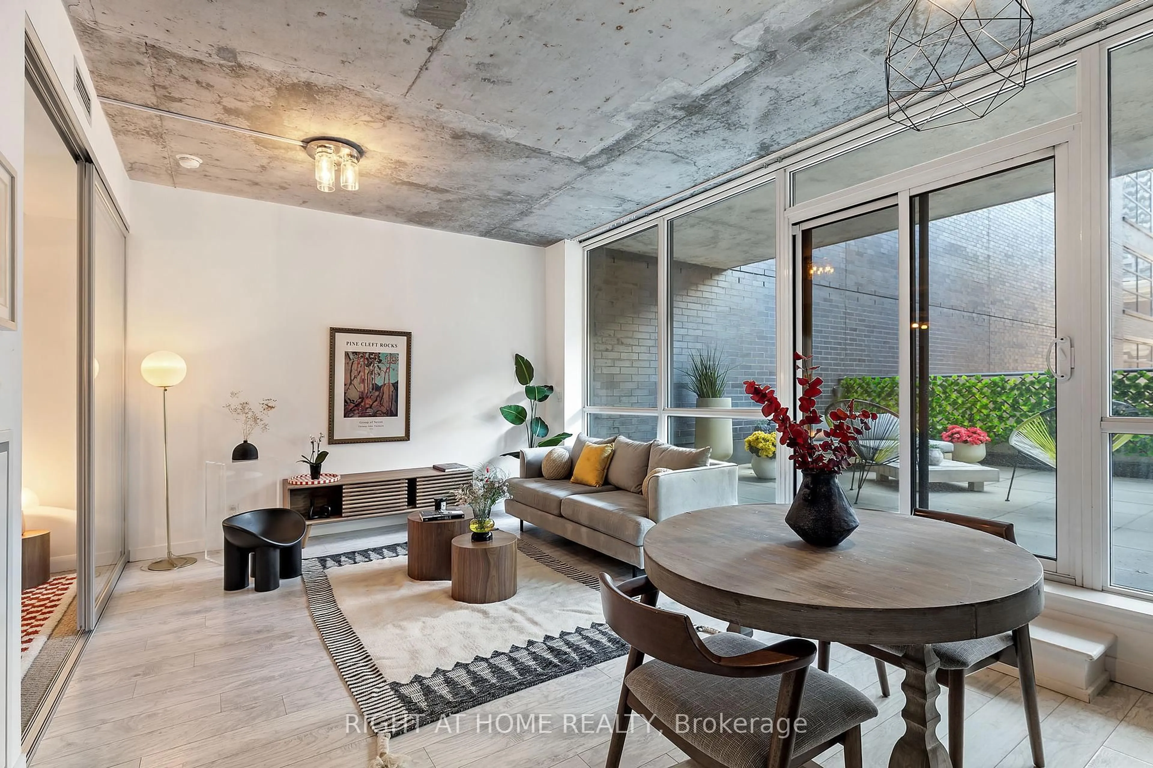 Living room with furniture, cement floor for 478 king St #312, Toronto Ontario M5V 0A8