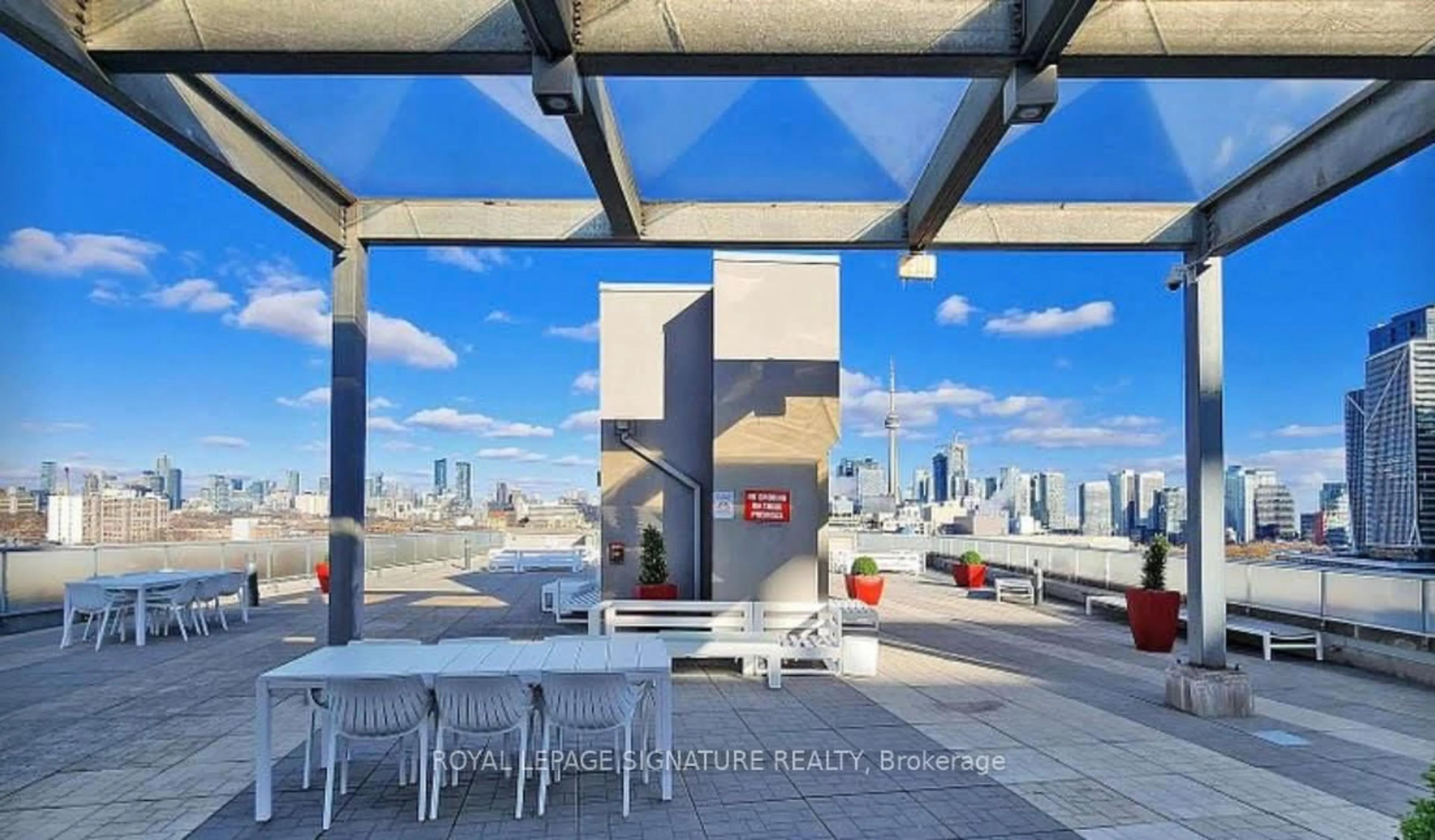 Patio, city buildings view from balcony for 1 Shaw St #705, Toronto Ontario M6K 0A1