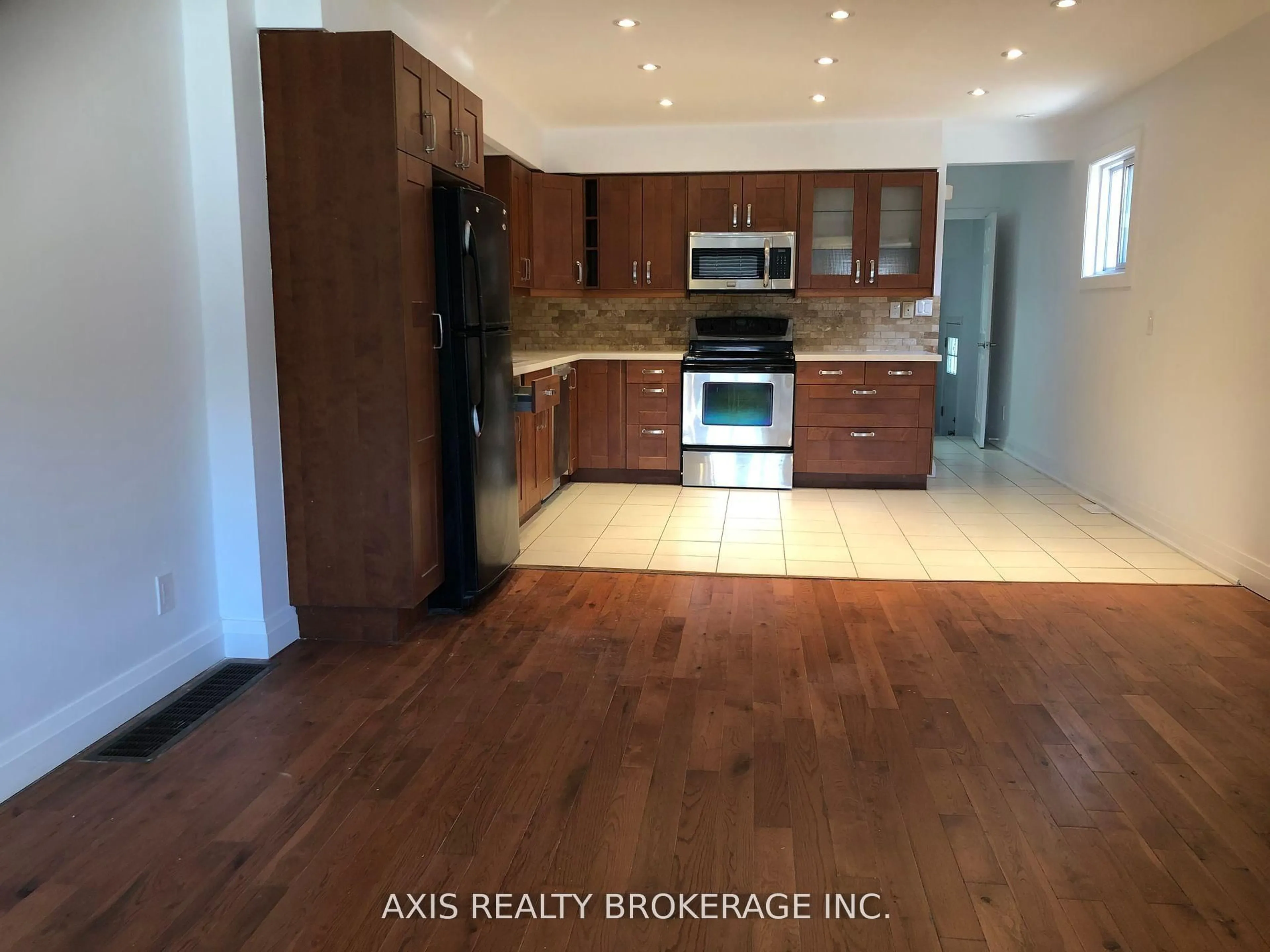 Open concept kitchen, wood/laminate floor for 596 Glenholme Ave, Toronto Ontario M6E 3G4
