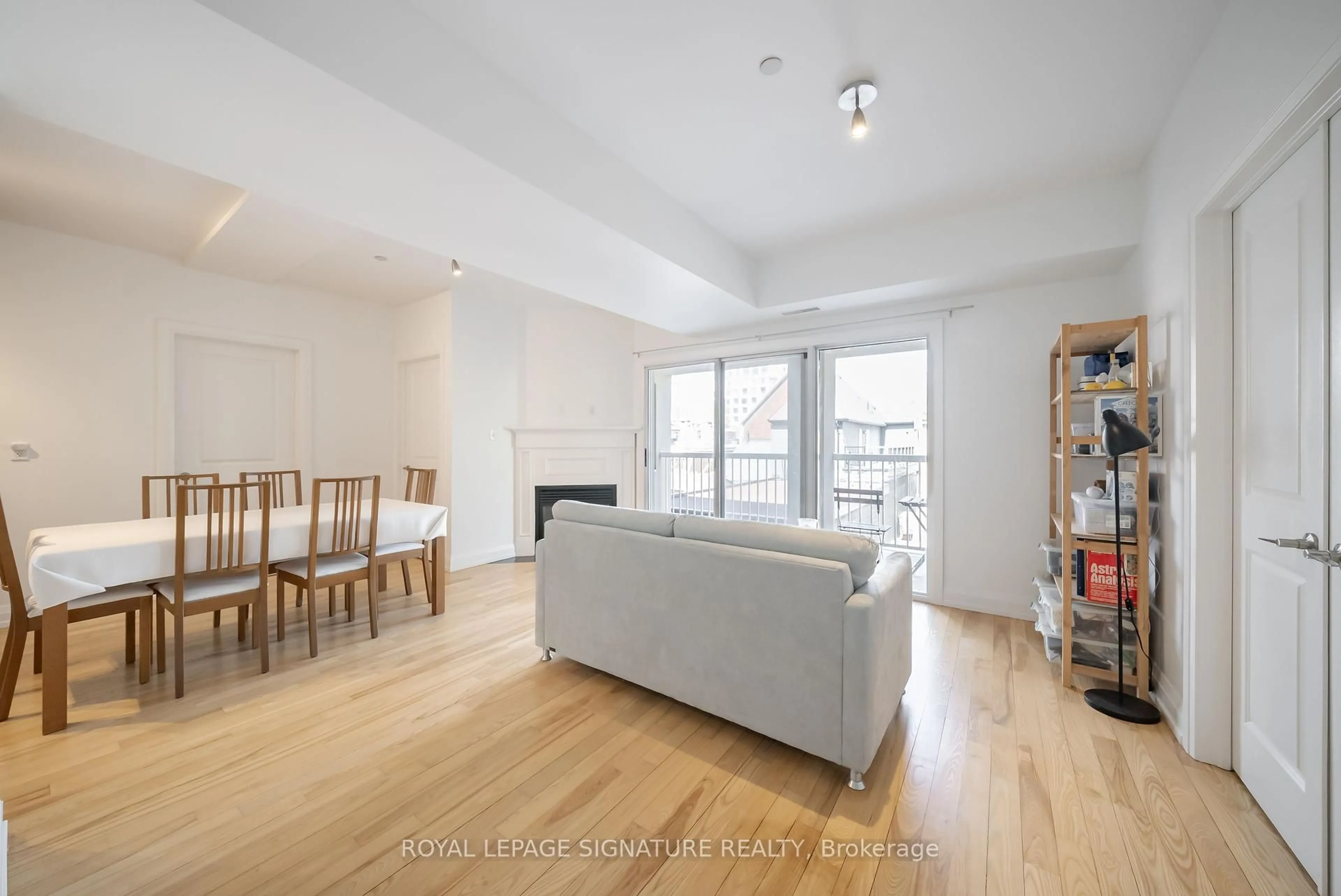 Living room with furniture, wood/laminate floor for 473 Dupont St #3, Toronto Ontario M6G 1Y6