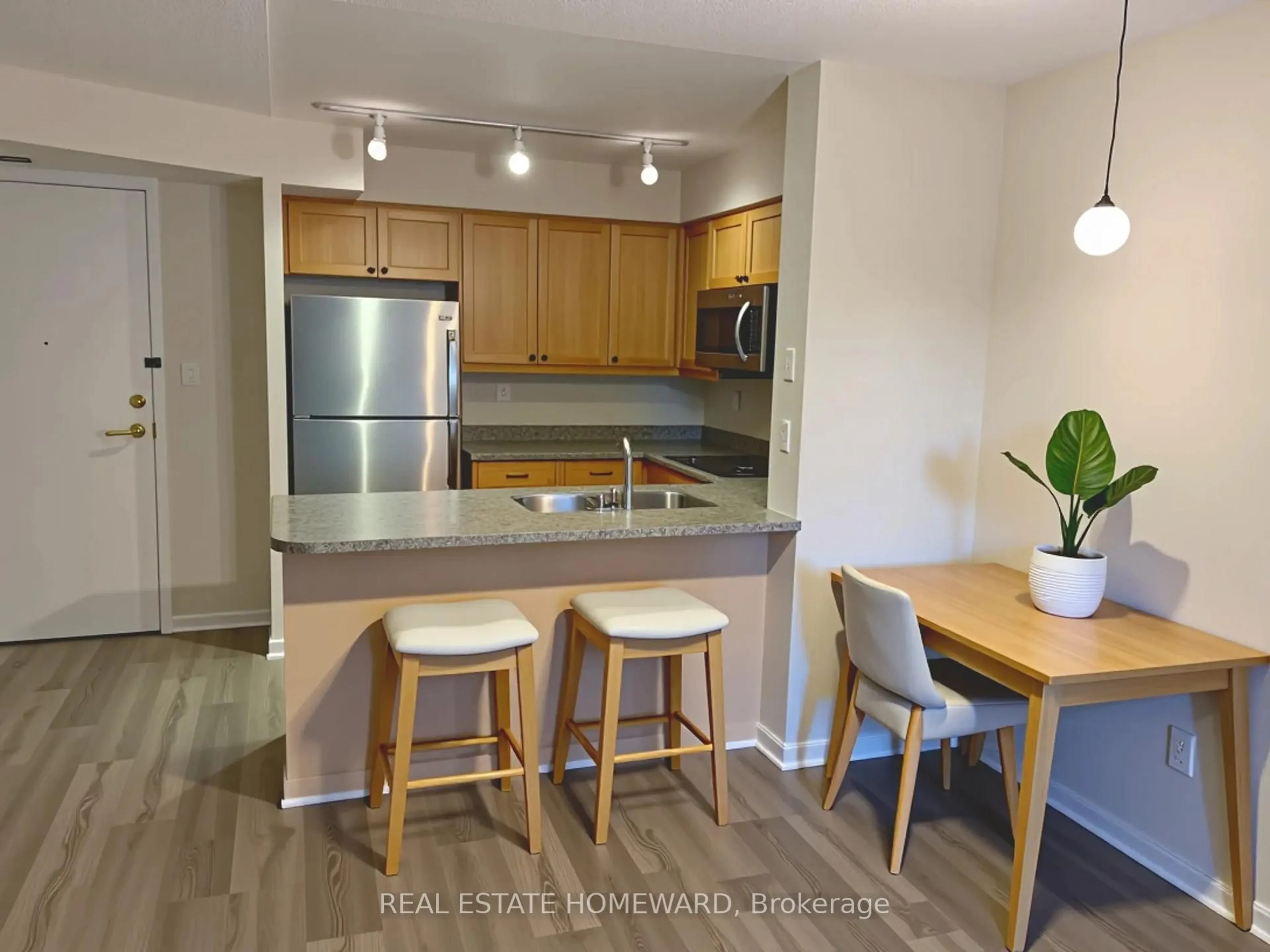 Open concept kitchen, wood/laminate floor for 188 Redpath Ave #405, Toronto Ontario M4P 3J2