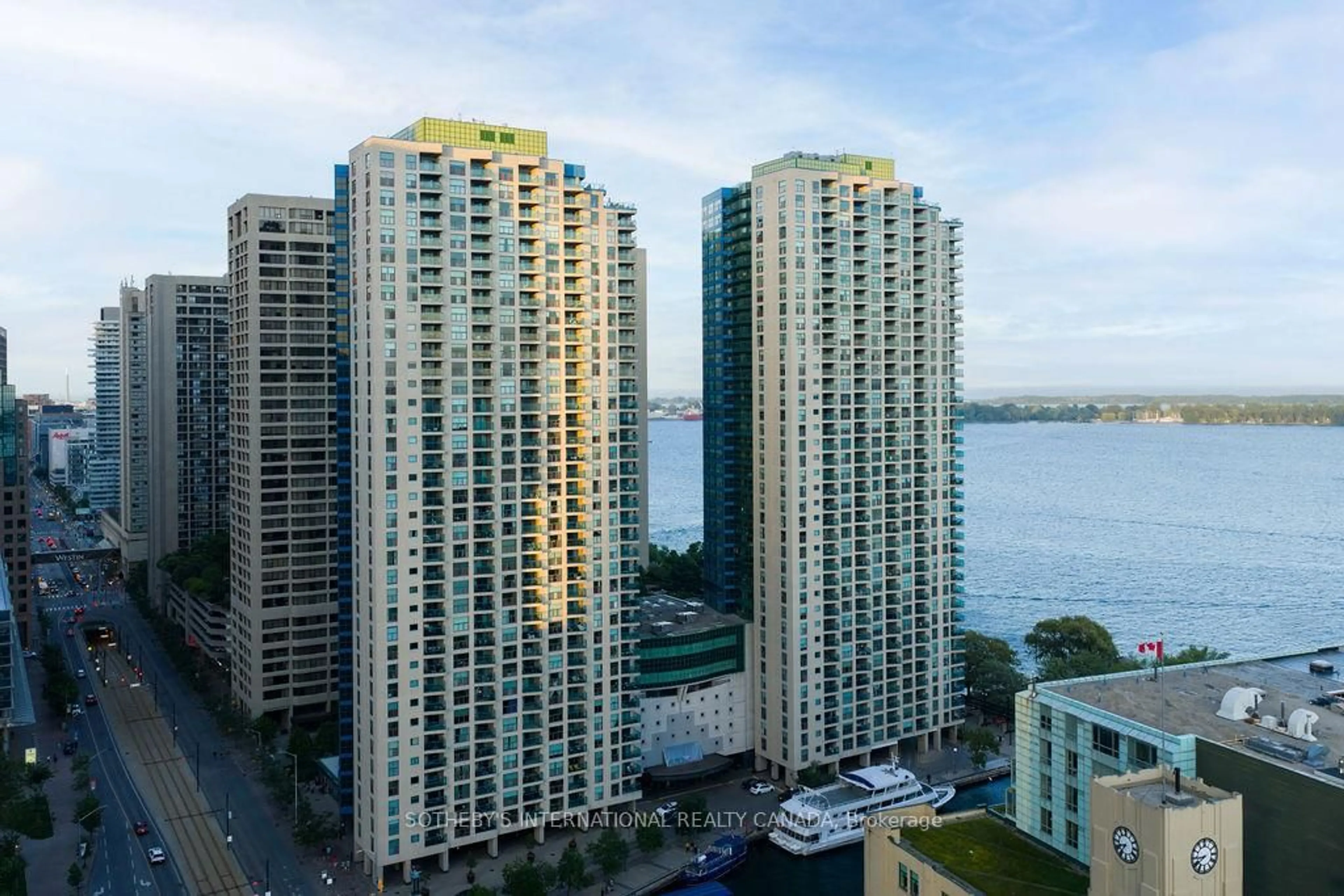 A pic from outside/outdoor area/front of a property/back of a property/a pic from drone, city buildings view from balcony for 77 Harbour Sq #3208, Toronto Ontario M5J 2S2