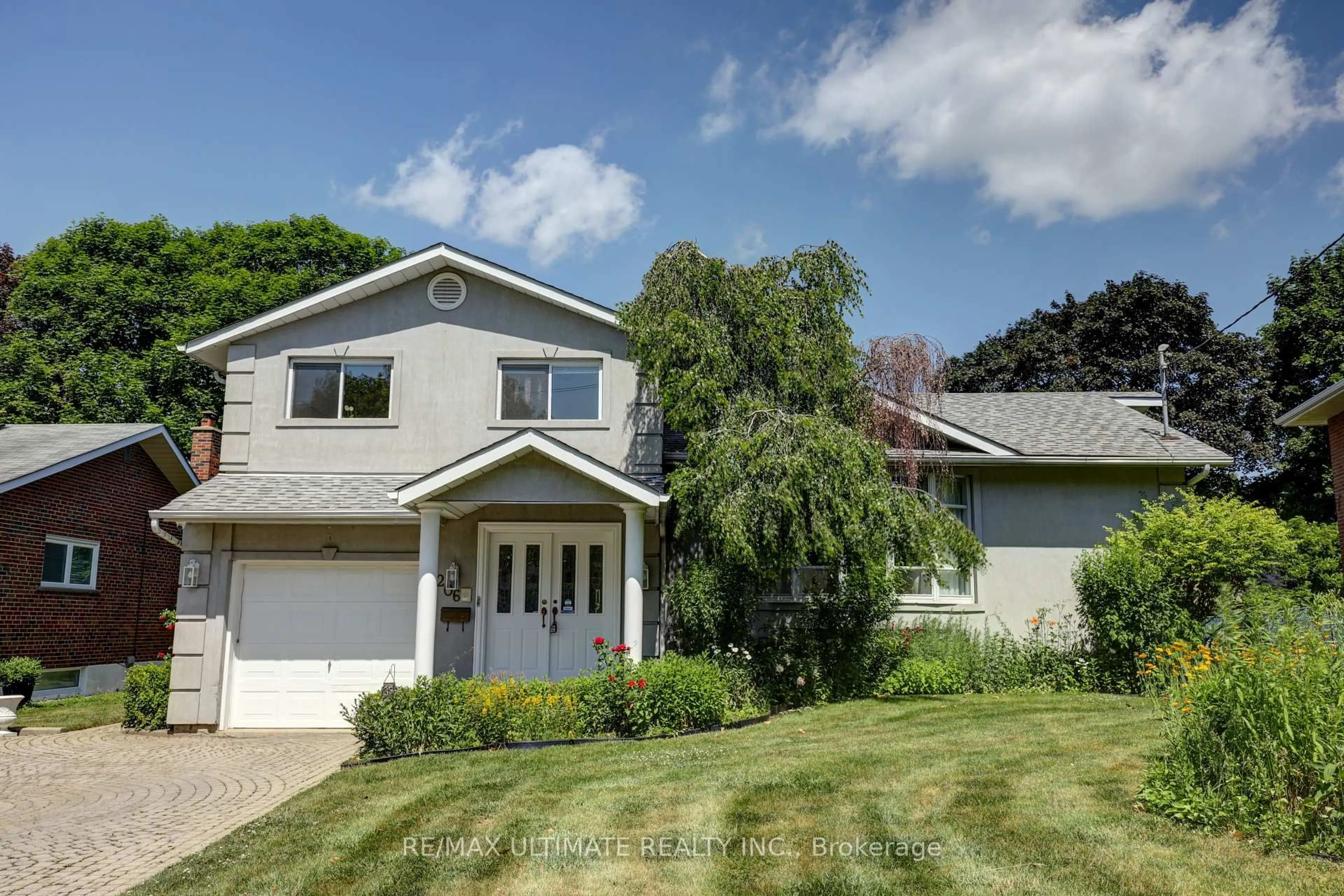 Home with vinyl exterior material, street for 206 Sloane Ave, Toronto Ontario M4A 2C6