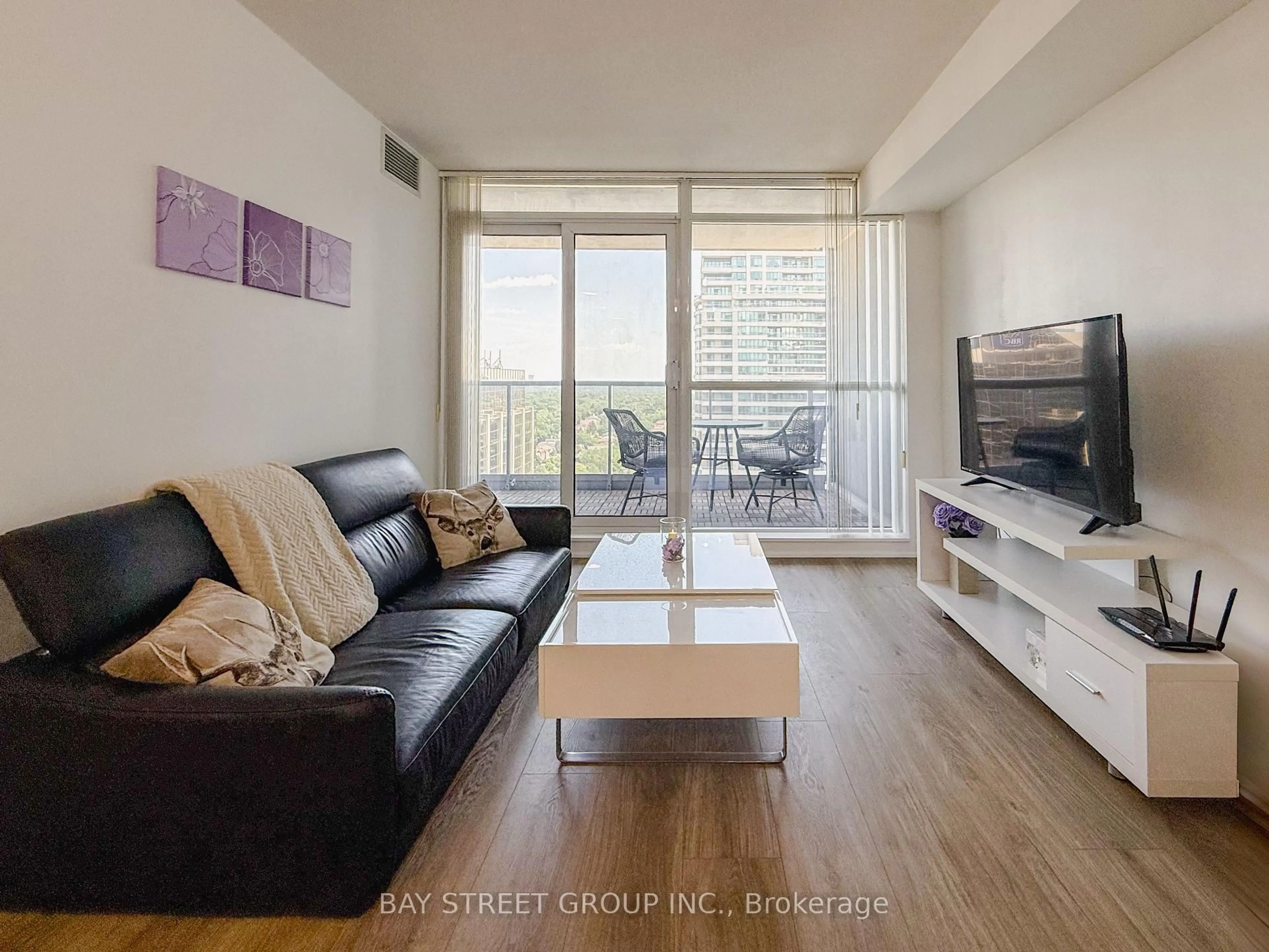 Living room with furniture, wood/laminate floor for 4968 Yonge St #3107, Toronto Ontario M2N 7G9