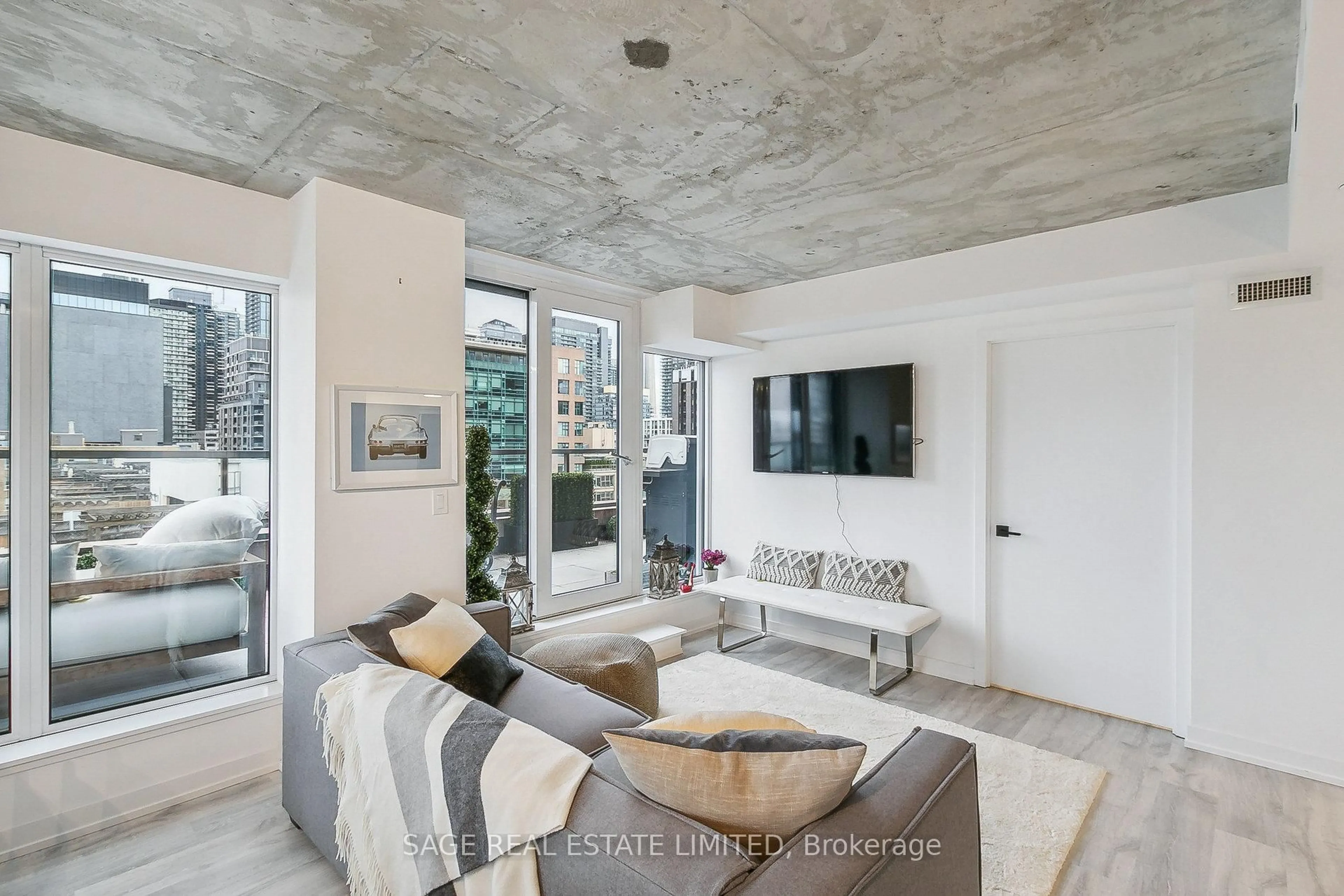 Living room with furniture, cement floor for 2 Augusta Ave #801, Toronto Ontario M5V 0T3