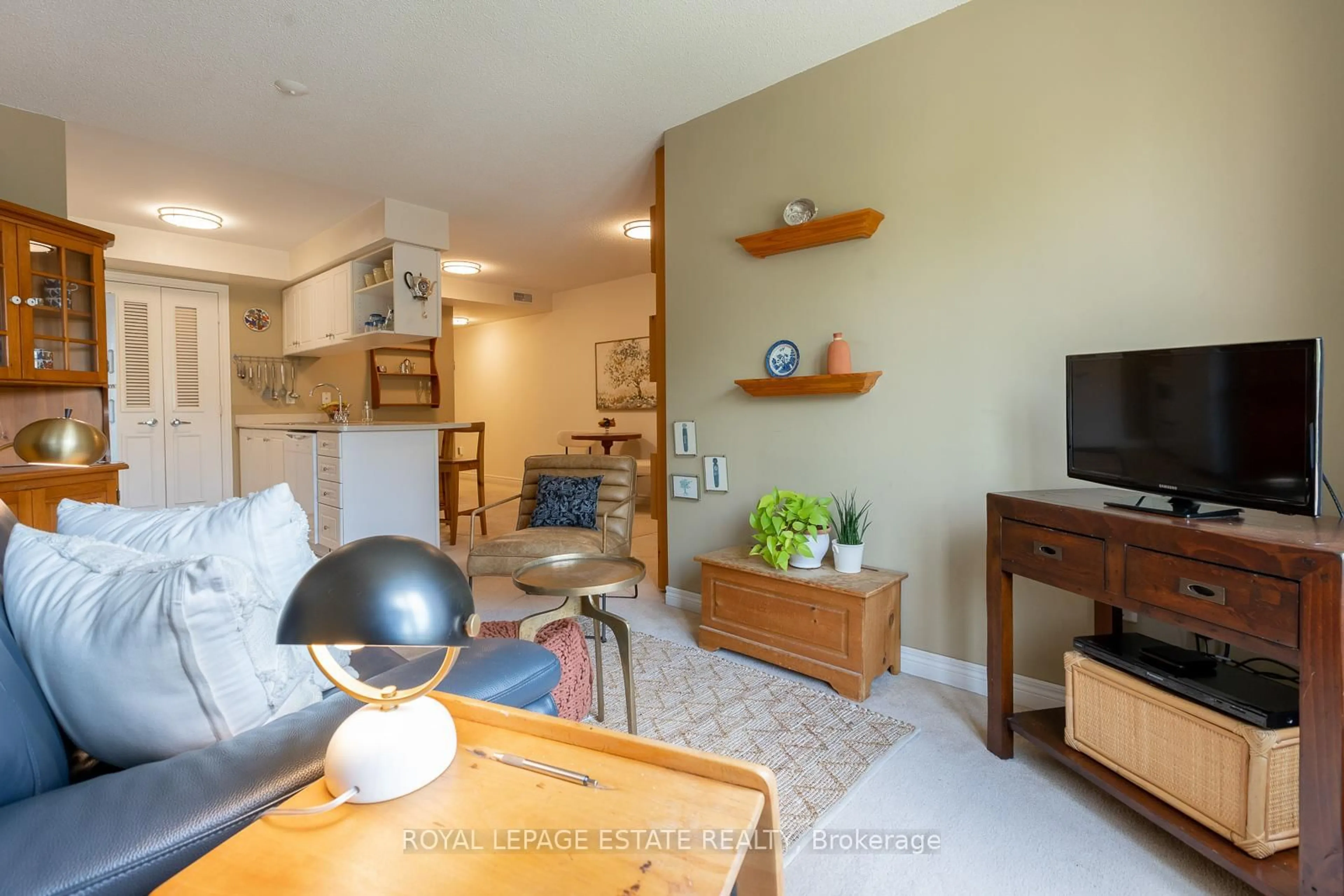 Living room with furniture, wood/laminate floor for 76 Aerodrome Cres #201, Toronto Ontario M4G 4J1
