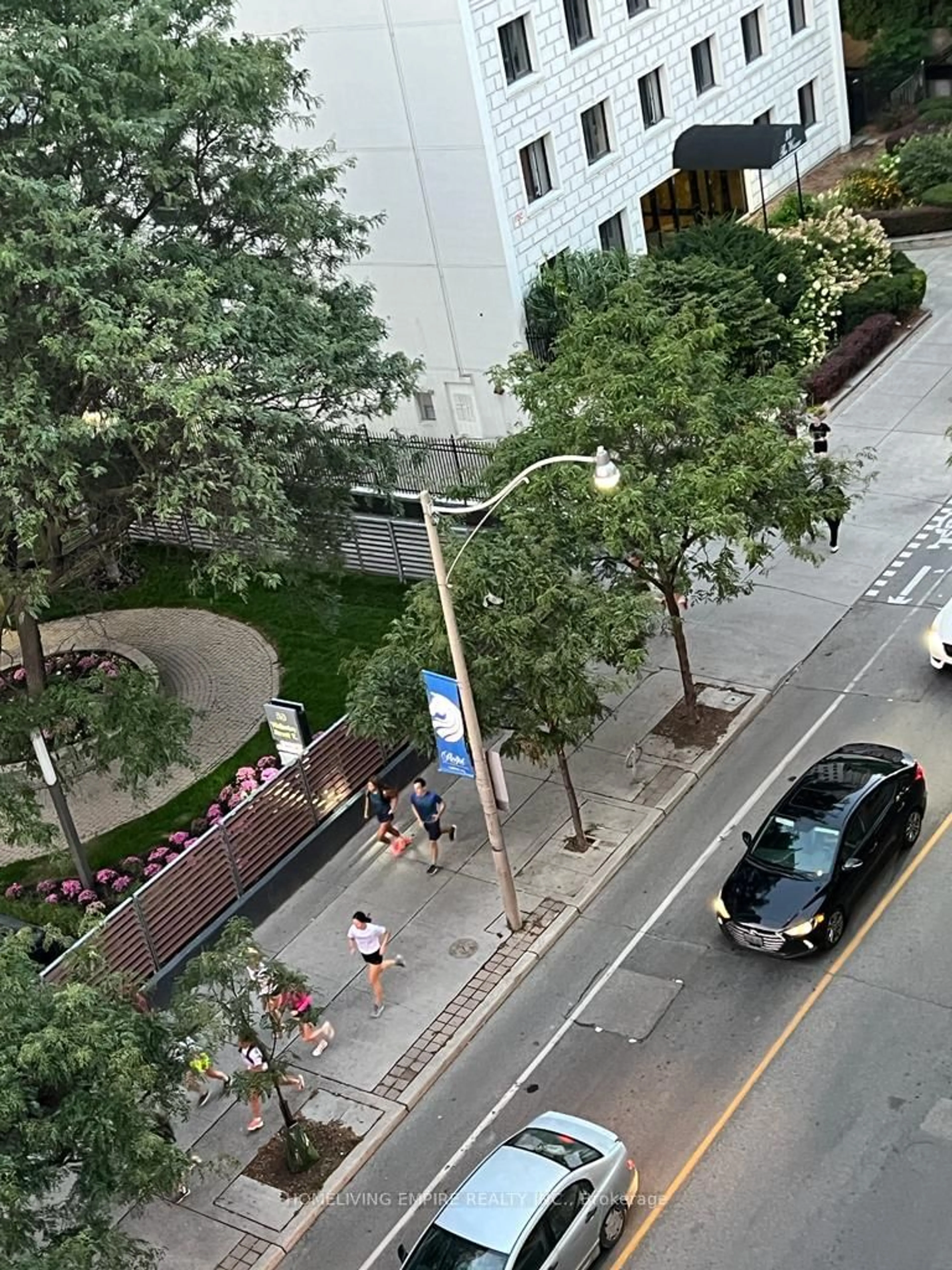 A pic from outside/outdoor area/front of a property/back of a property/a pic from drone, city buildings view from balcony for 81 Wellesley St #306, Toronto Ontario M4Y 0C5