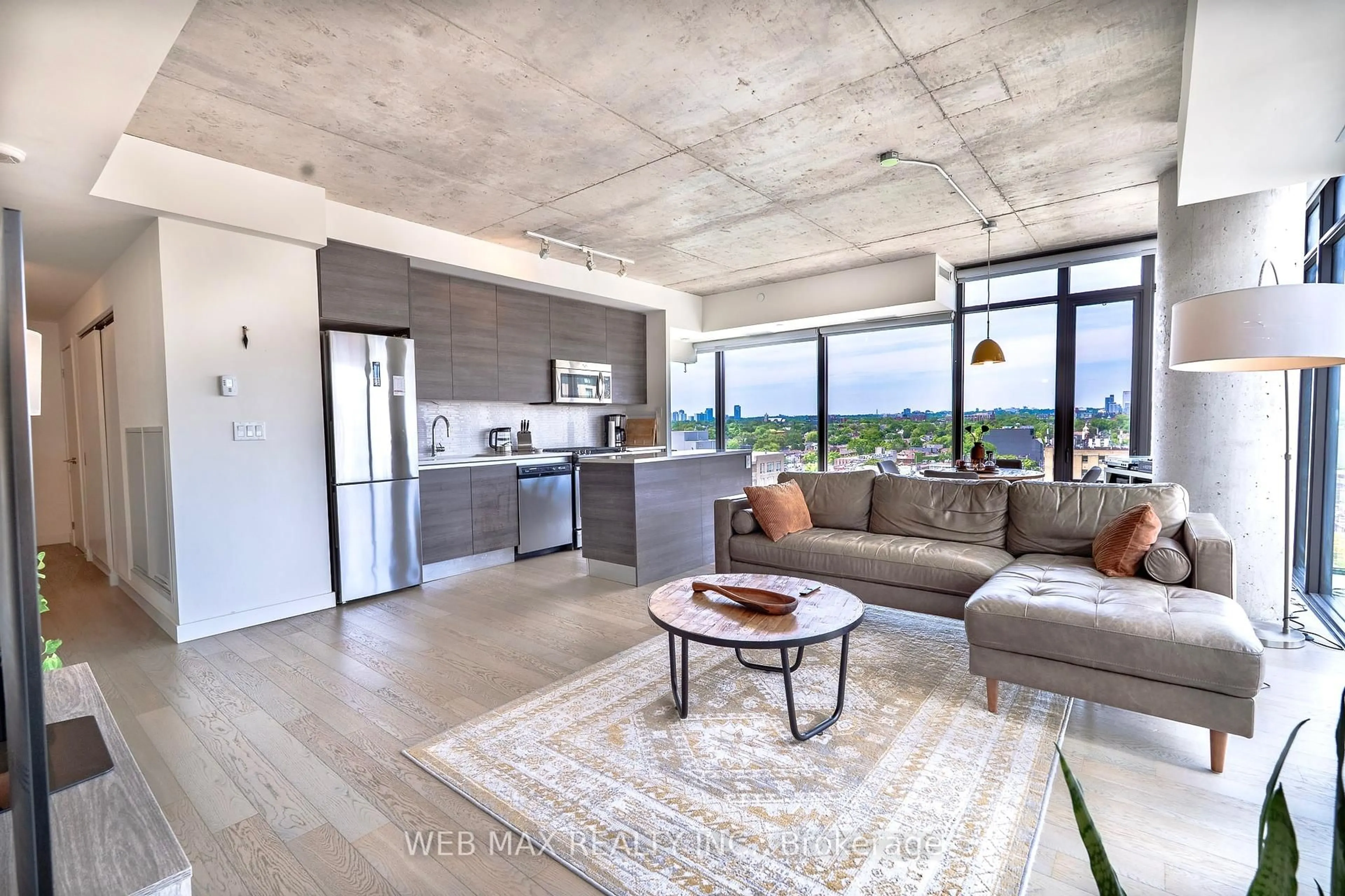 Open concept kitchen, cement floor for 111 Bathurst St #1005, Toronto Ontario M5V 0M9