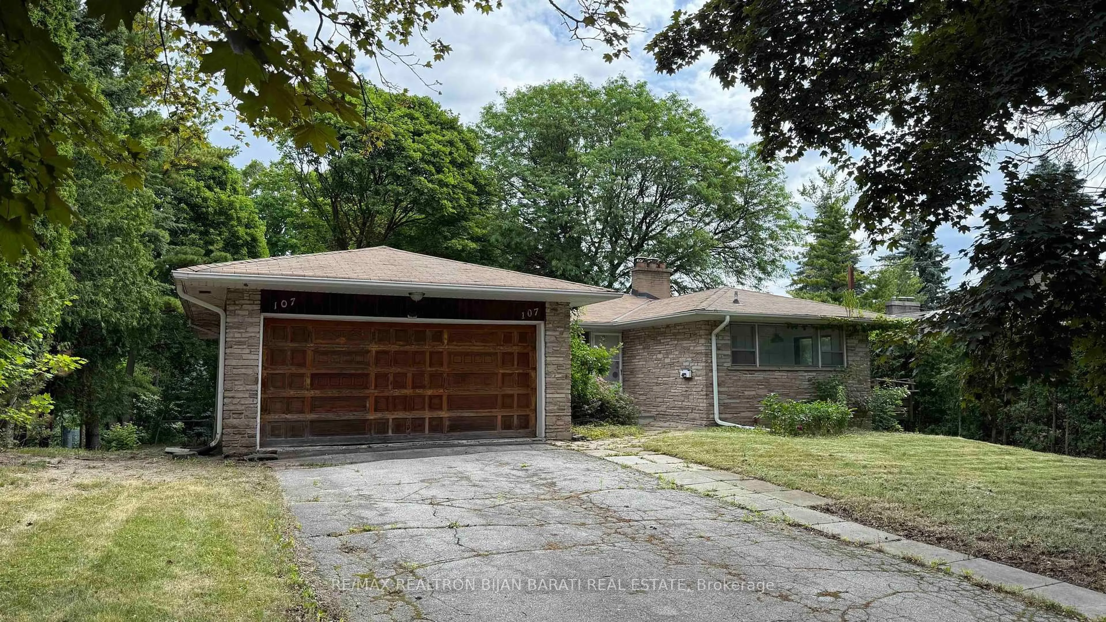 Home with brick exterior material, street for 107 Burbank Dr, Toronto Ontario M2K 1N6