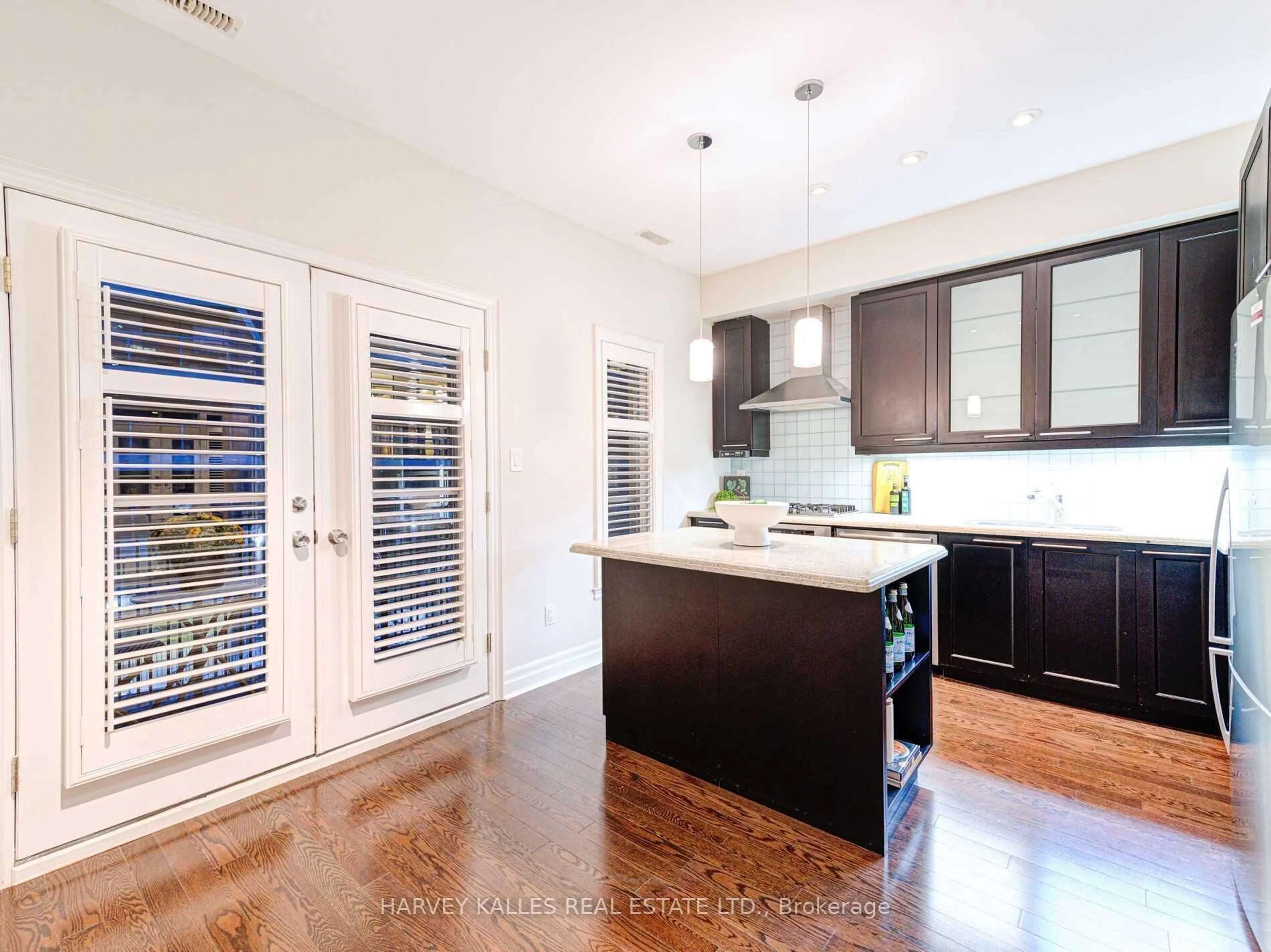 Open concept kitchen, wood/laminate floor for 73 Pleasant Blvd, Toronto Ontario M4T 1K2