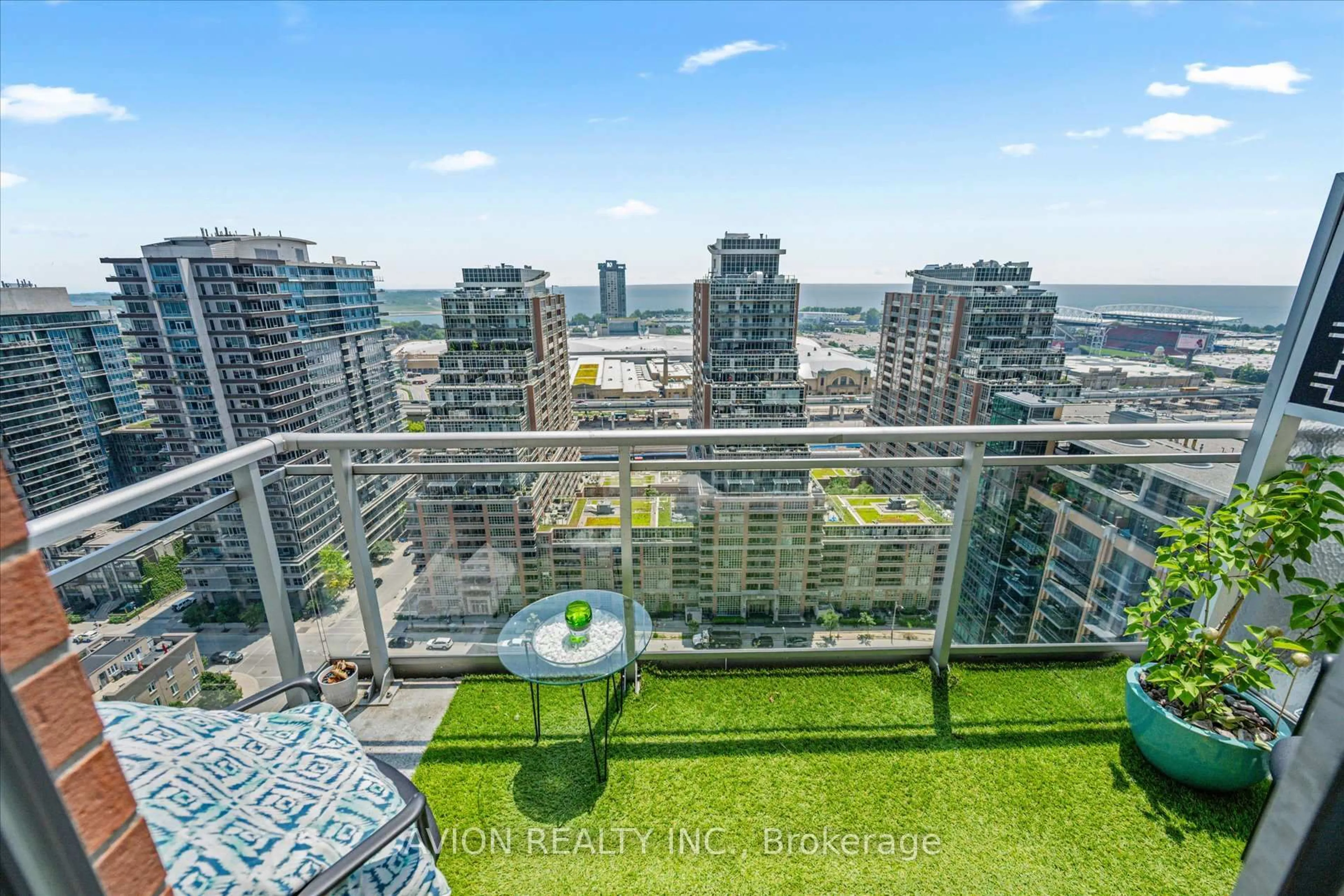 Balcony in the apartment, city buildings view from balcony for 50 Lynn Williams St #Ph 2402, Toronto Ontario M6K 3R9