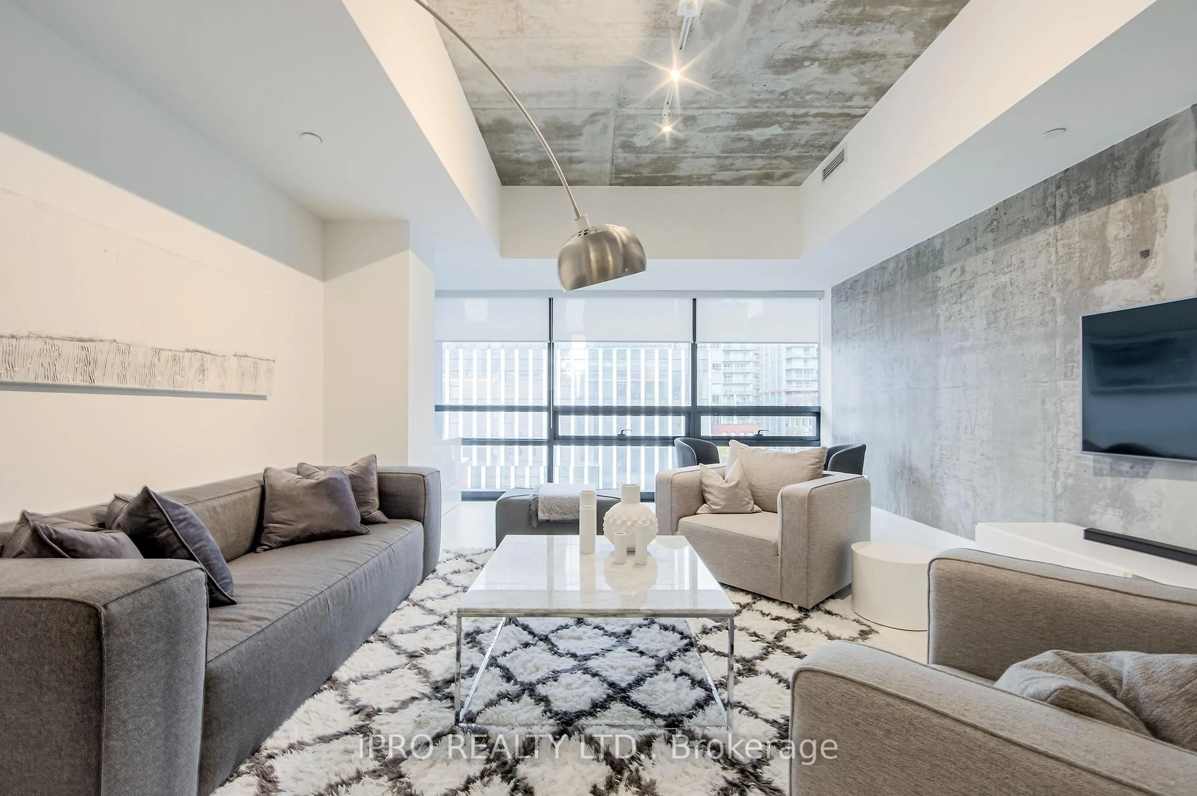 Living room with furniture, cement floor for 224 King St #501, Toronto Ontario M5V 1H8