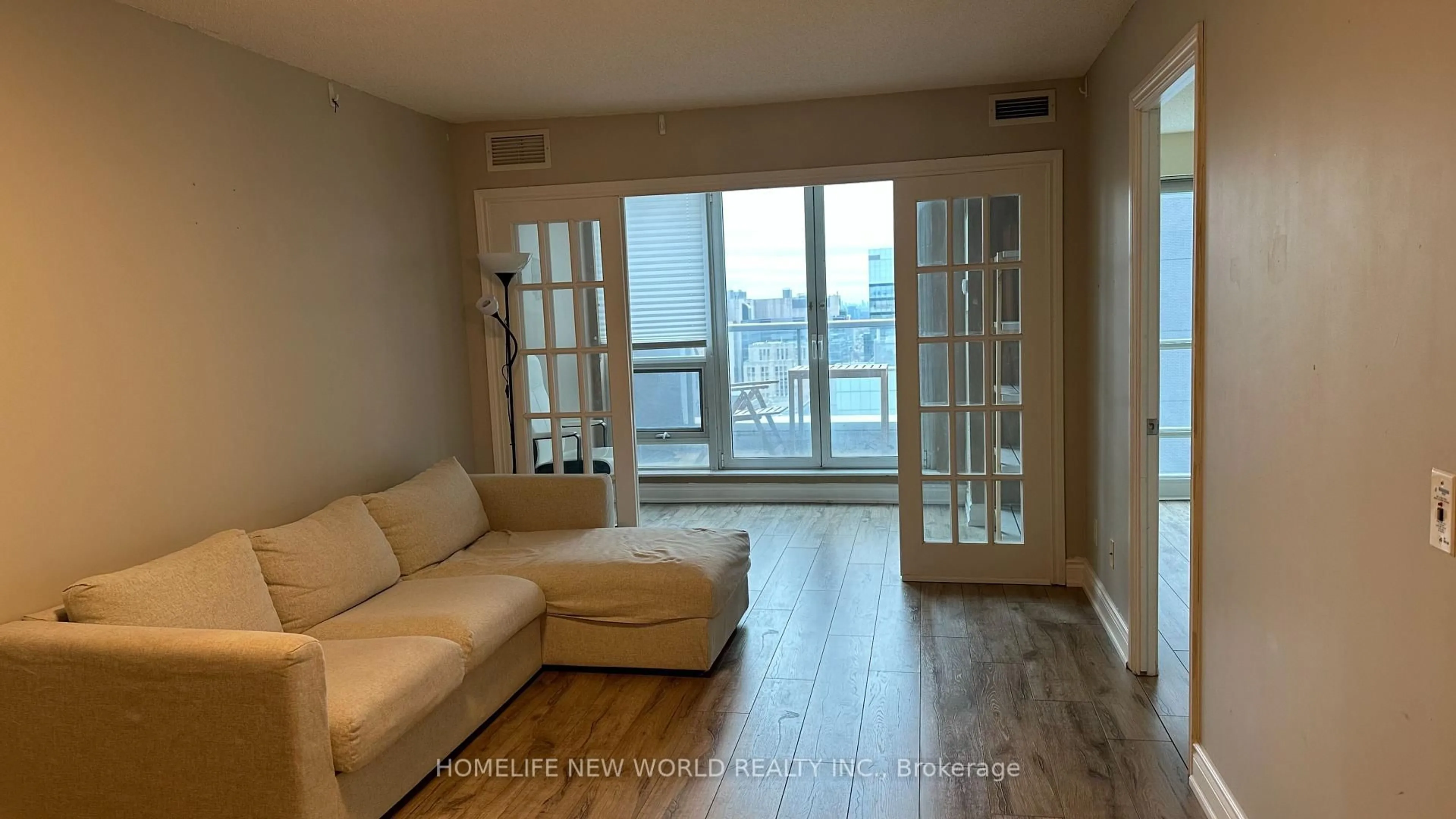 Living room with furniture, wood/laminate floor for 763 Bay St #3210, Toronto Ontario M5G 2R3