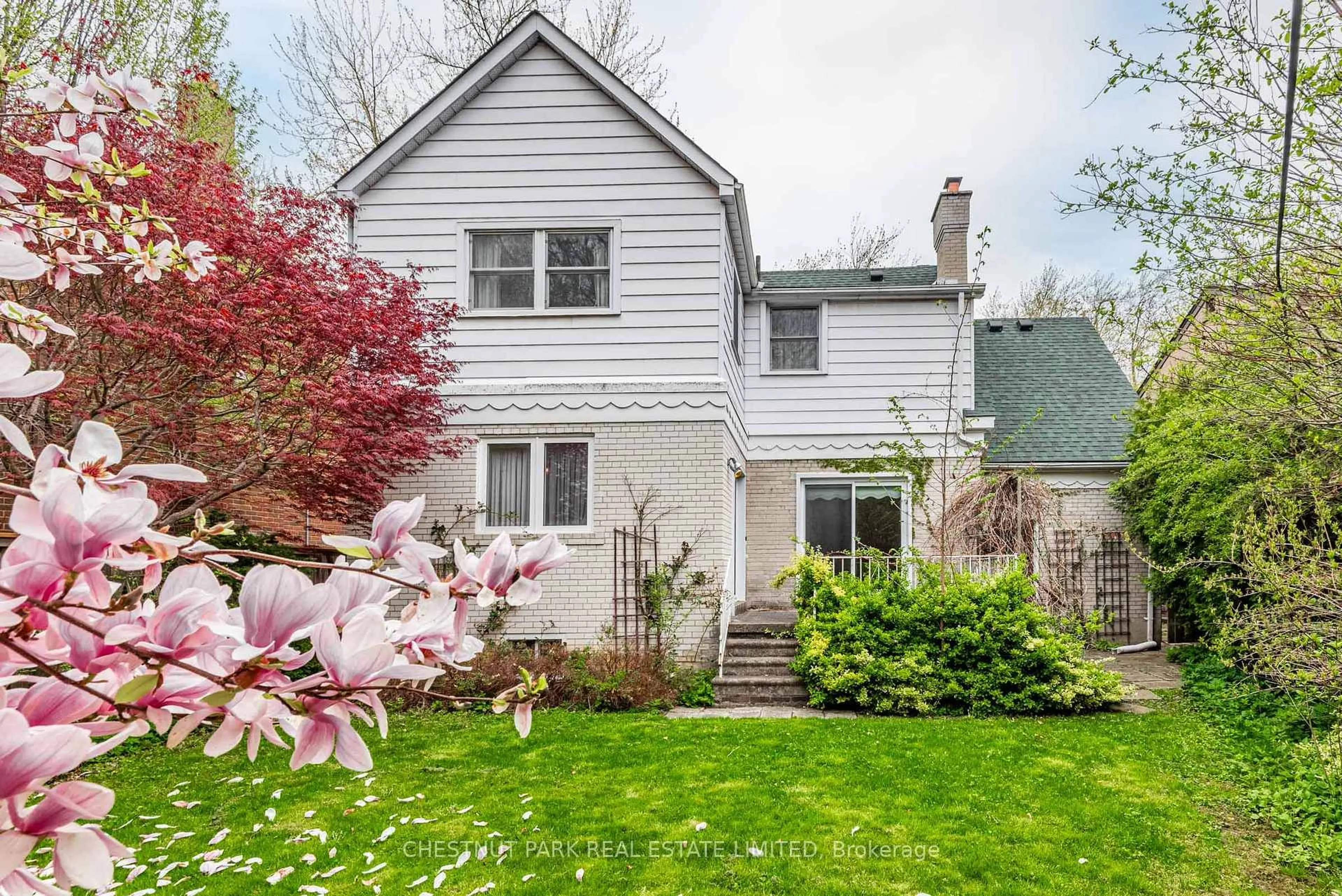 Home with vinyl exterior material, street for 53 Caribou Rd, Toronto Ontario M5N 2A6