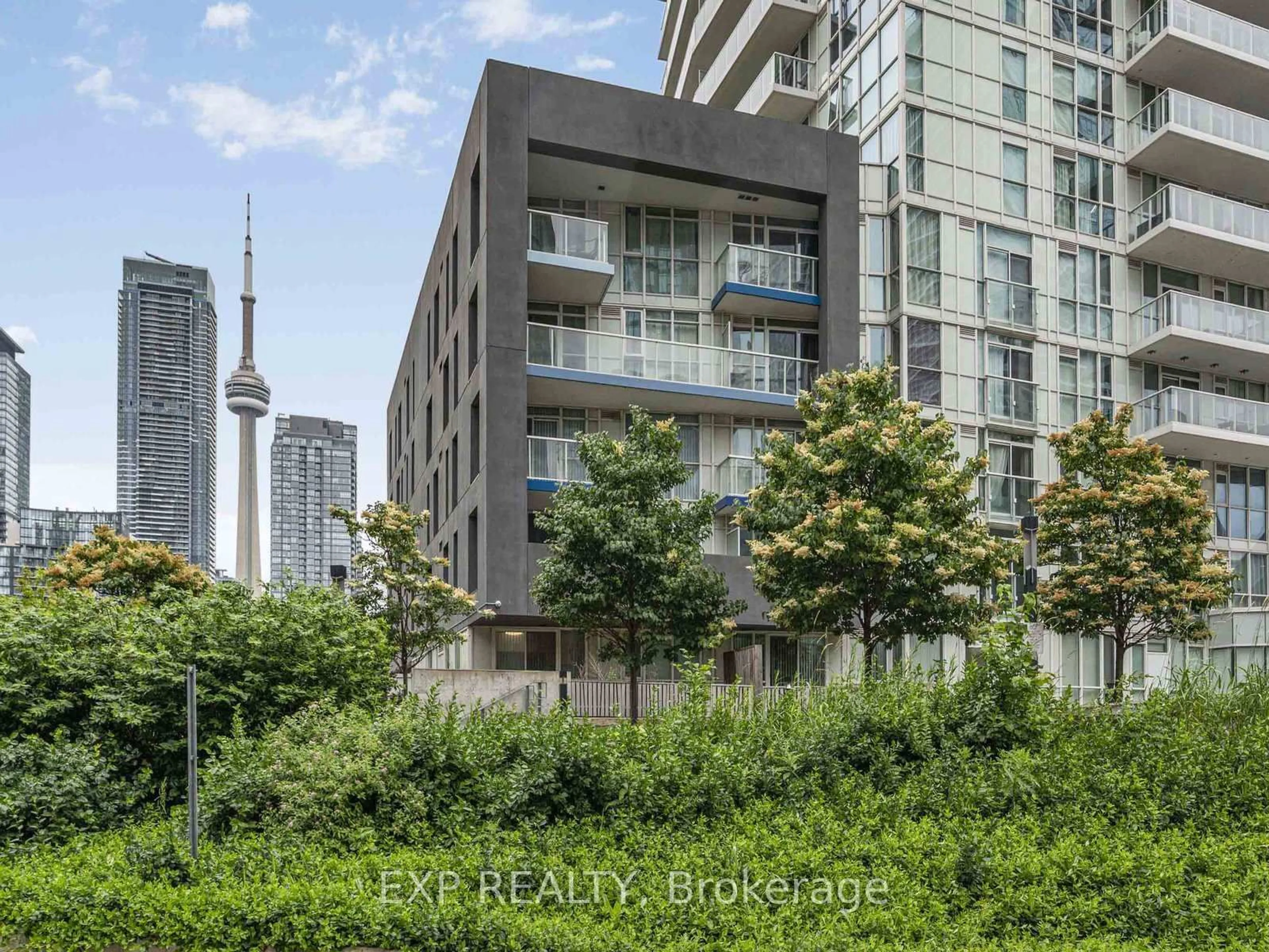 Patio, city buildings view from balcony for 75 Queens Wharf Rd #116, Toronto Ontario M5V 0J8