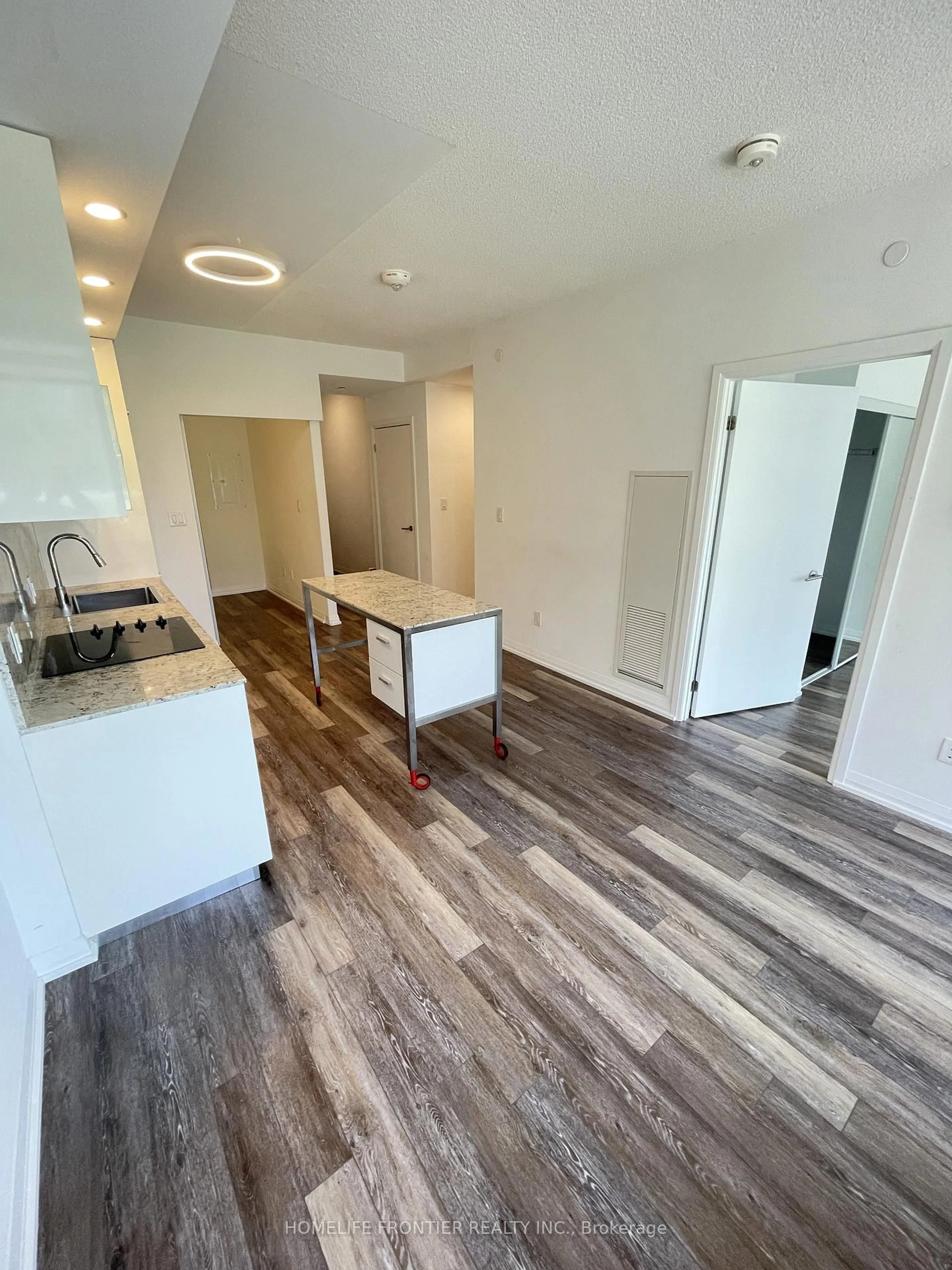 Open concept kitchen, wood/laminate floor for 75 Canterbury Pl #312, Toronto Ontario M2N 0L2