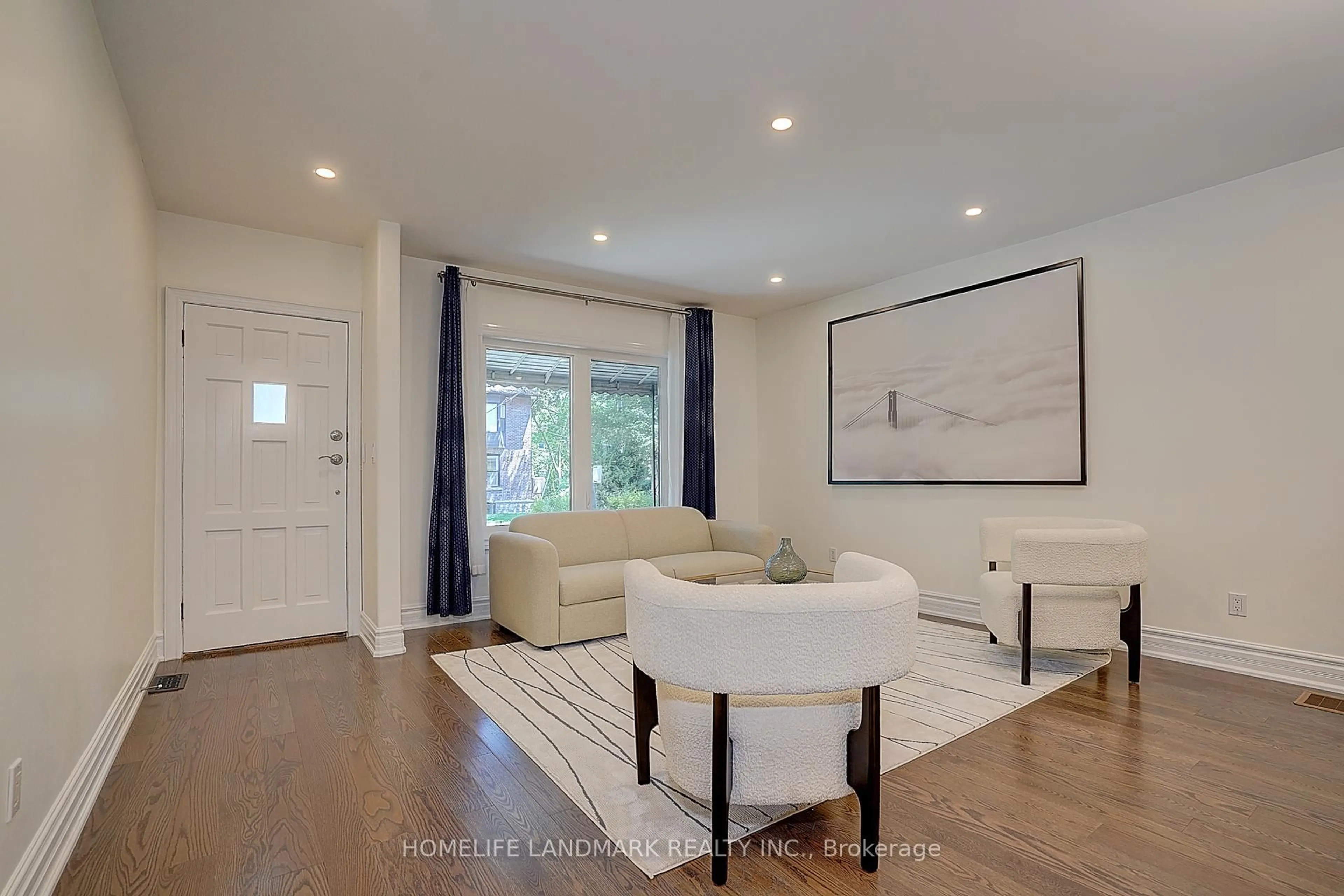 Living room with furniture, wood/laminate floor for 596 Palmerston Ave, Toronto Ontario M6G 2P9