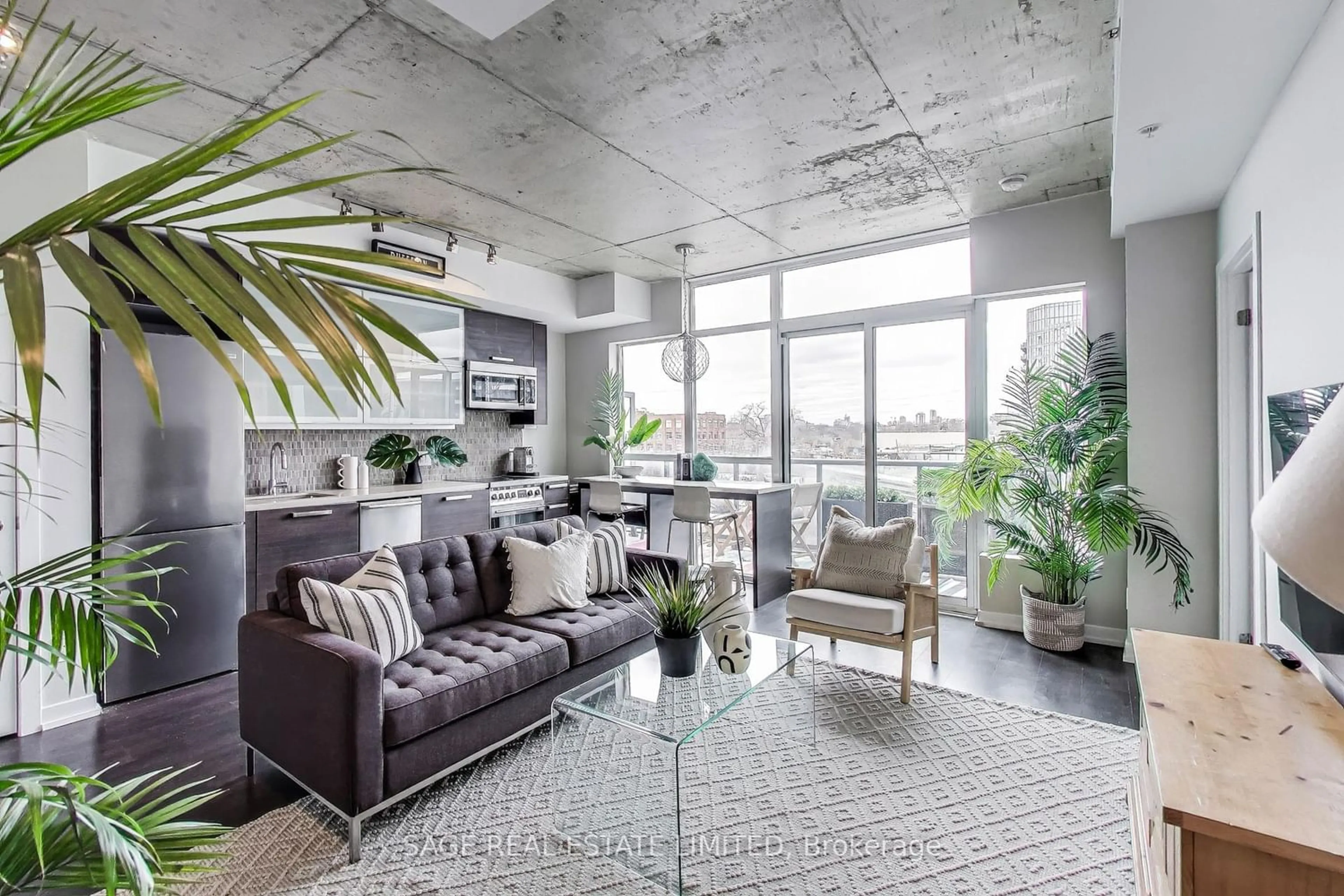 Living room with furniture, cement floor for 1205 Queen St #604, Toronto Ontario M6K 1L2