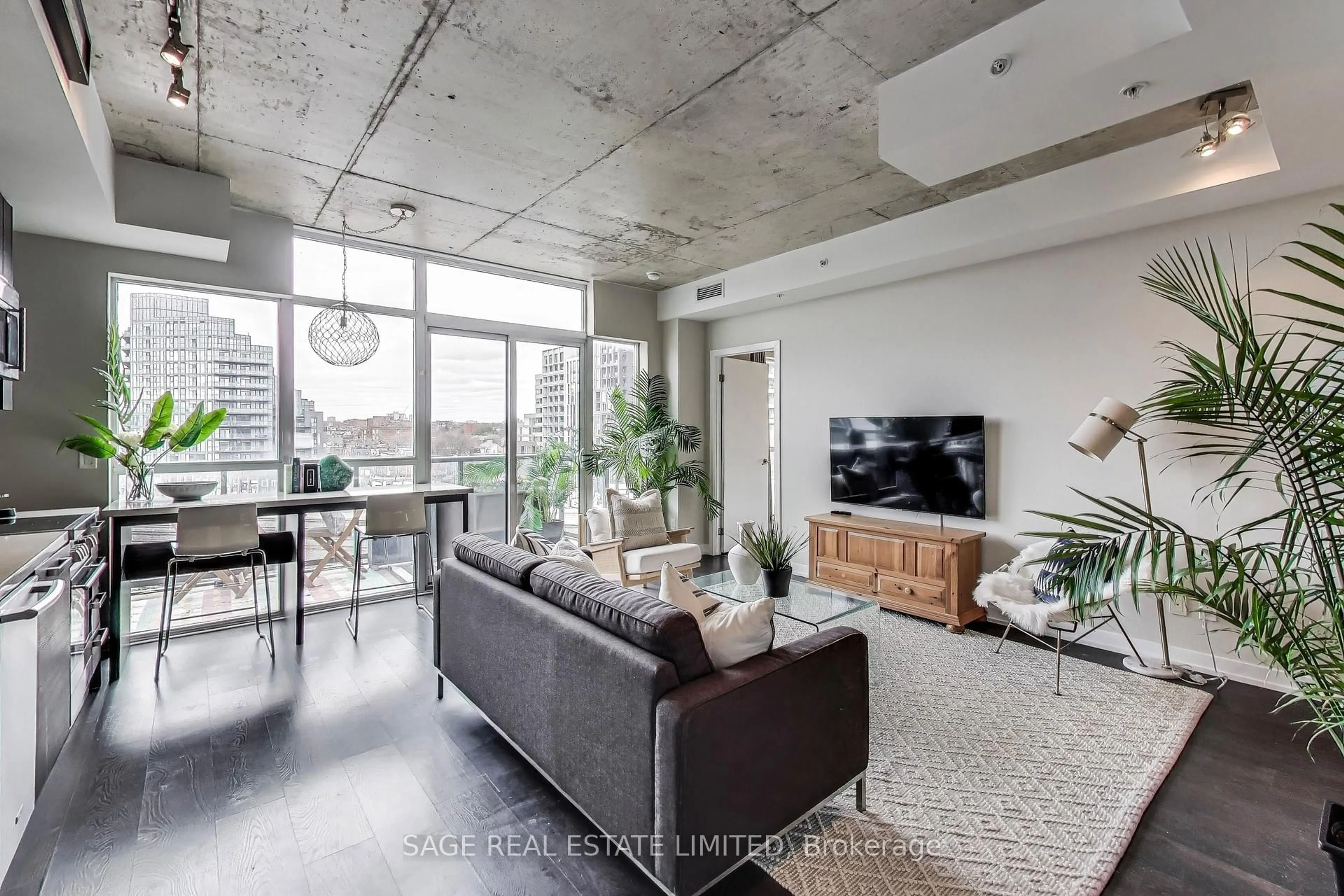 Living room with furniture, cement floor for 1205 Queen St #604, Toronto Ontario M6K 1L2