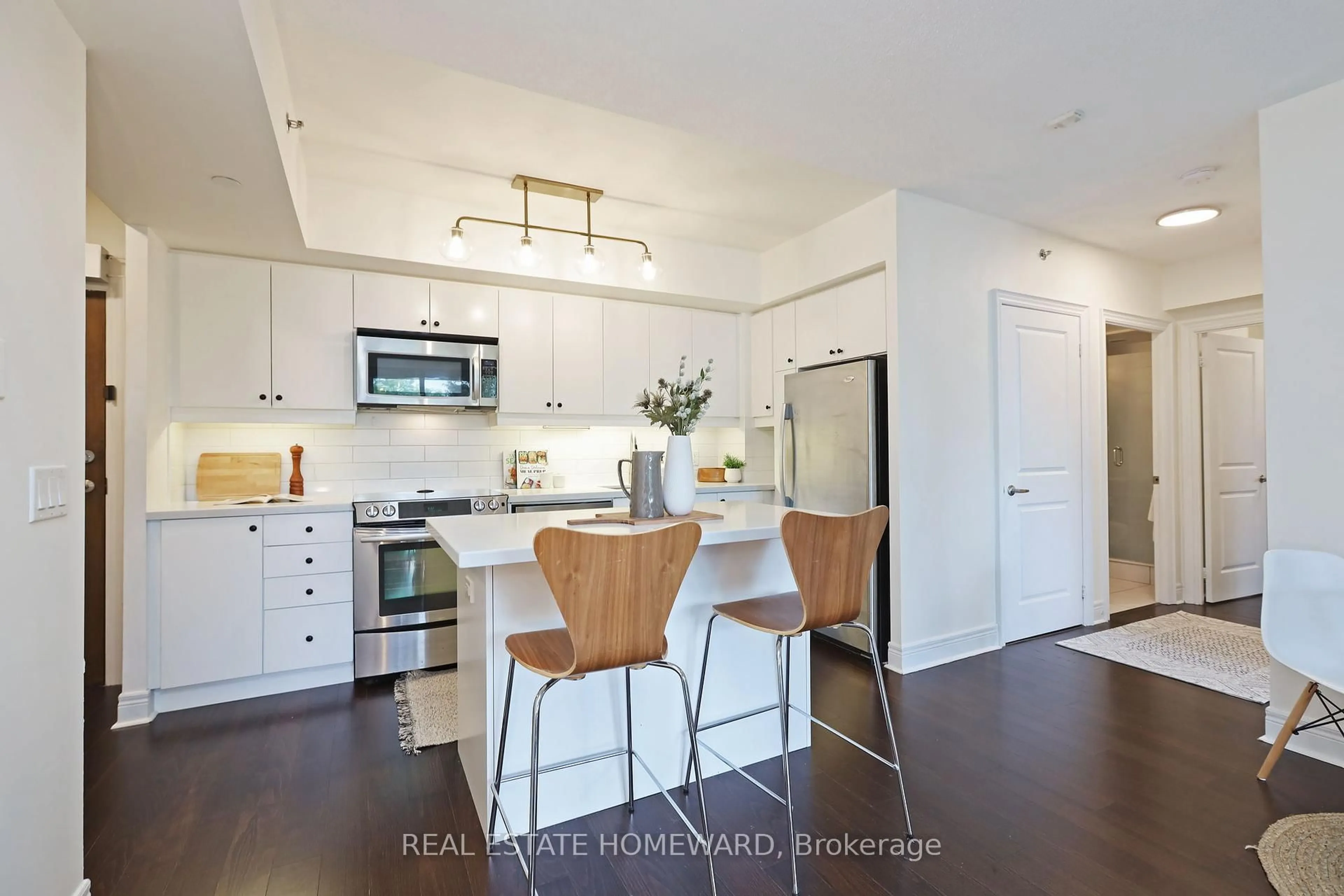 Open concept kitchen, wood/laminate floor for 701 Sheppard Ave #302, Toronto Ontario M3H 0B2