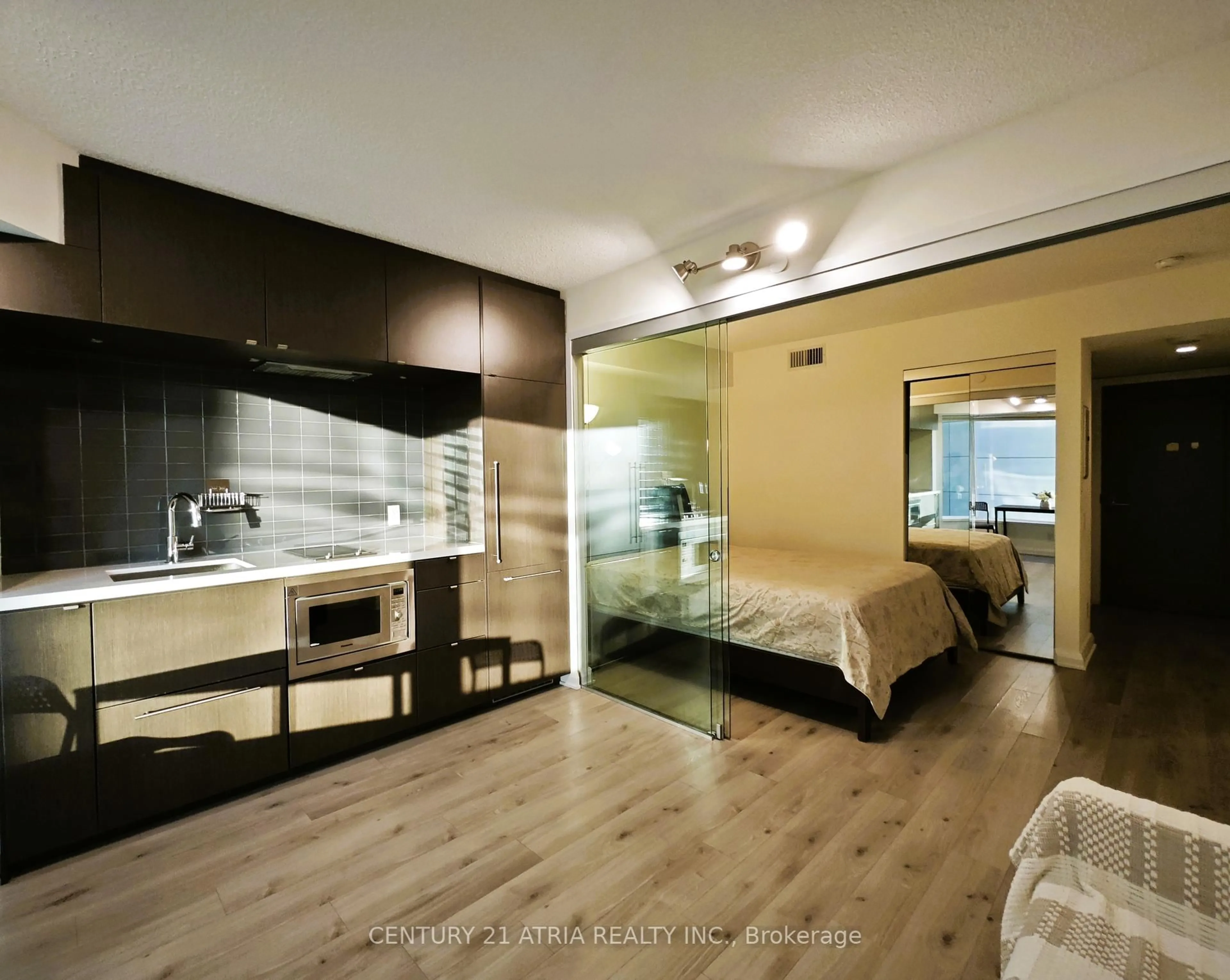 Bedroom with bed, wood/laminate floor for 155 Yorkville Ave #605, Toronto Ontario M5R 0B4