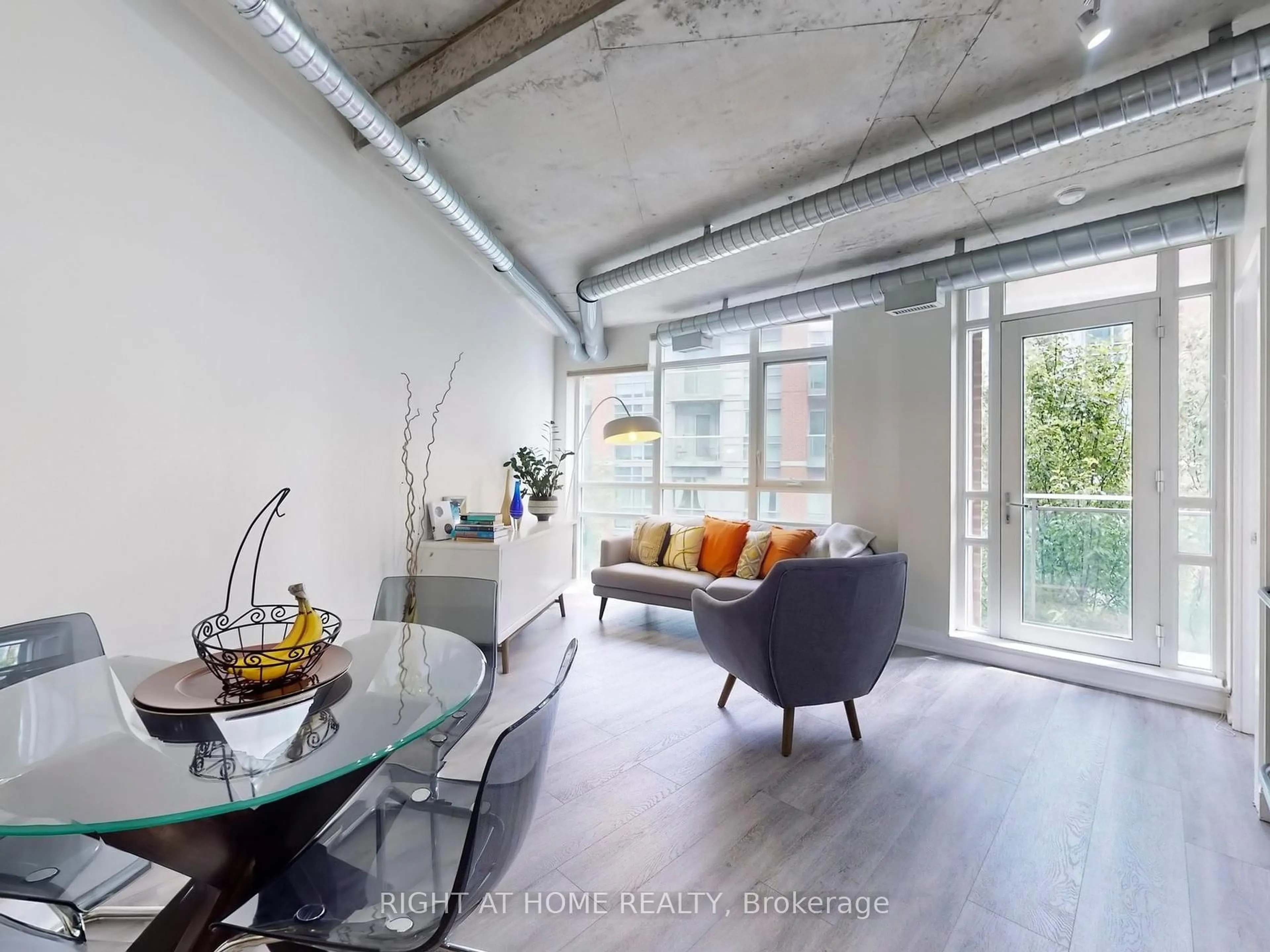 Living room with furniture, cement floor for 170 Sudbury St #415, Toronto Ontario M6J 0A1