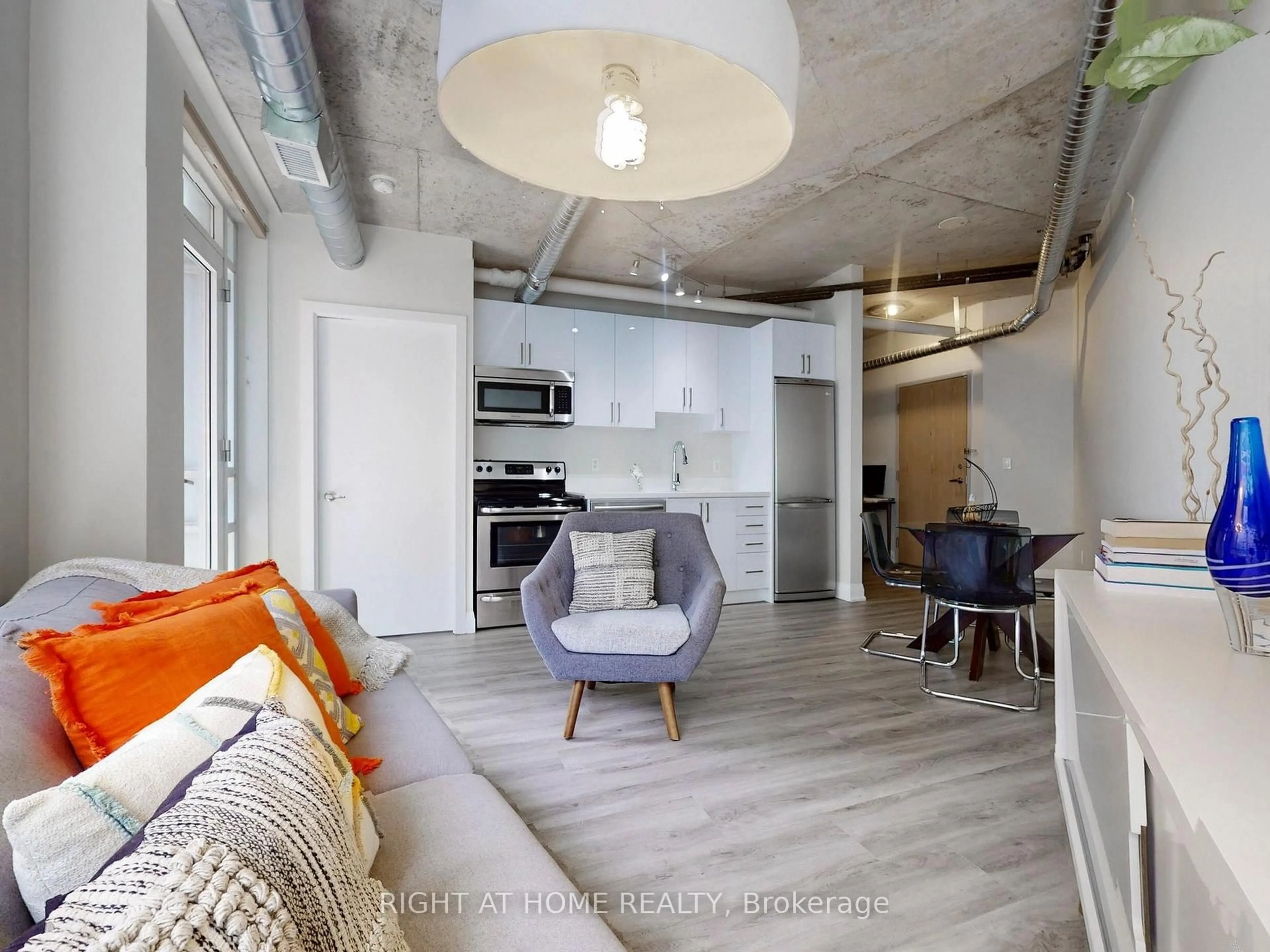 Open concept kitchen, cement floor for 170 Sudbury St #415, Toronto Ontario M6J 0A1