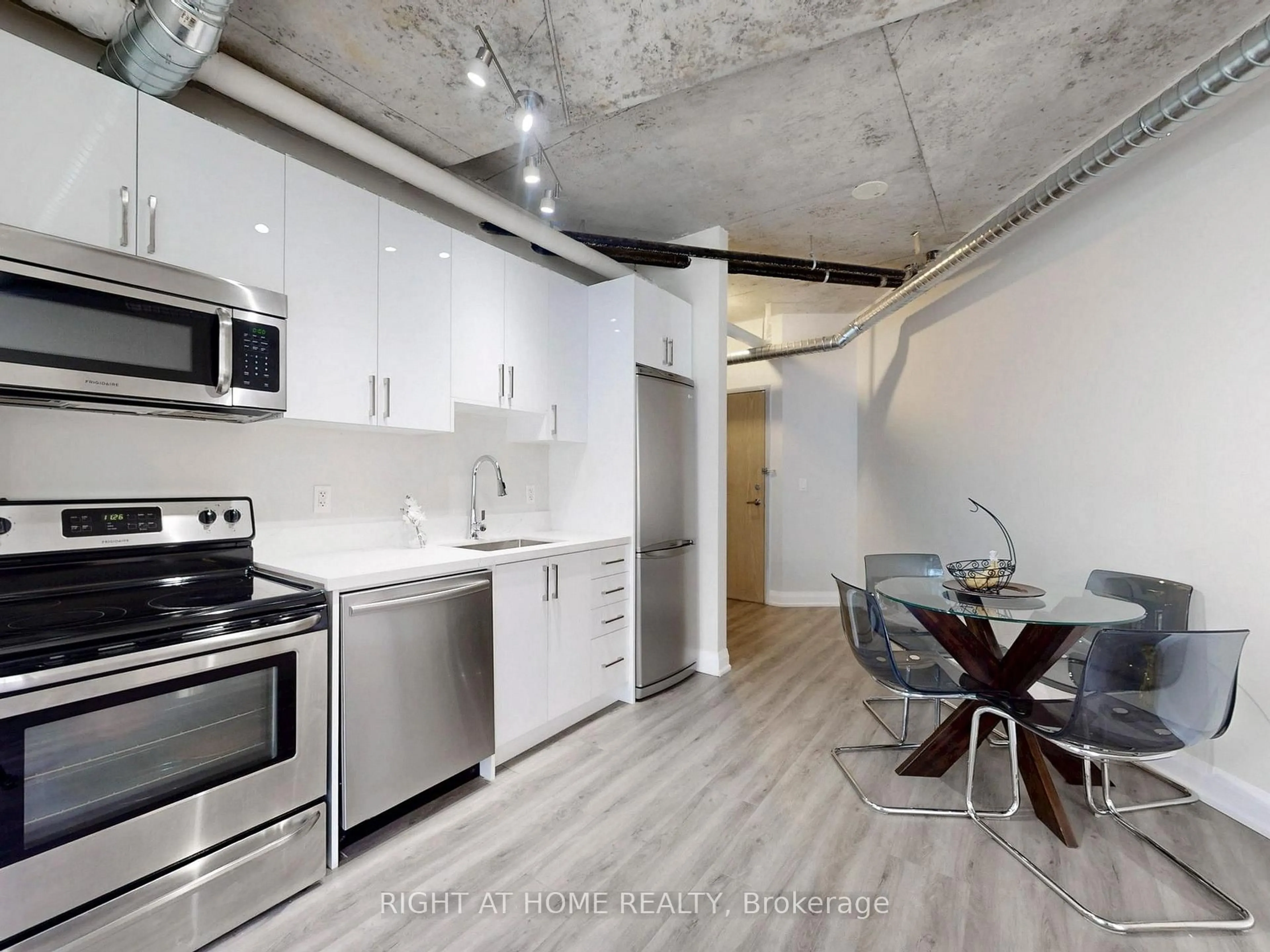 Open concept kitchen, cement floor for 170 Sudbury St #415, Toronto Ontario M6J 0A1