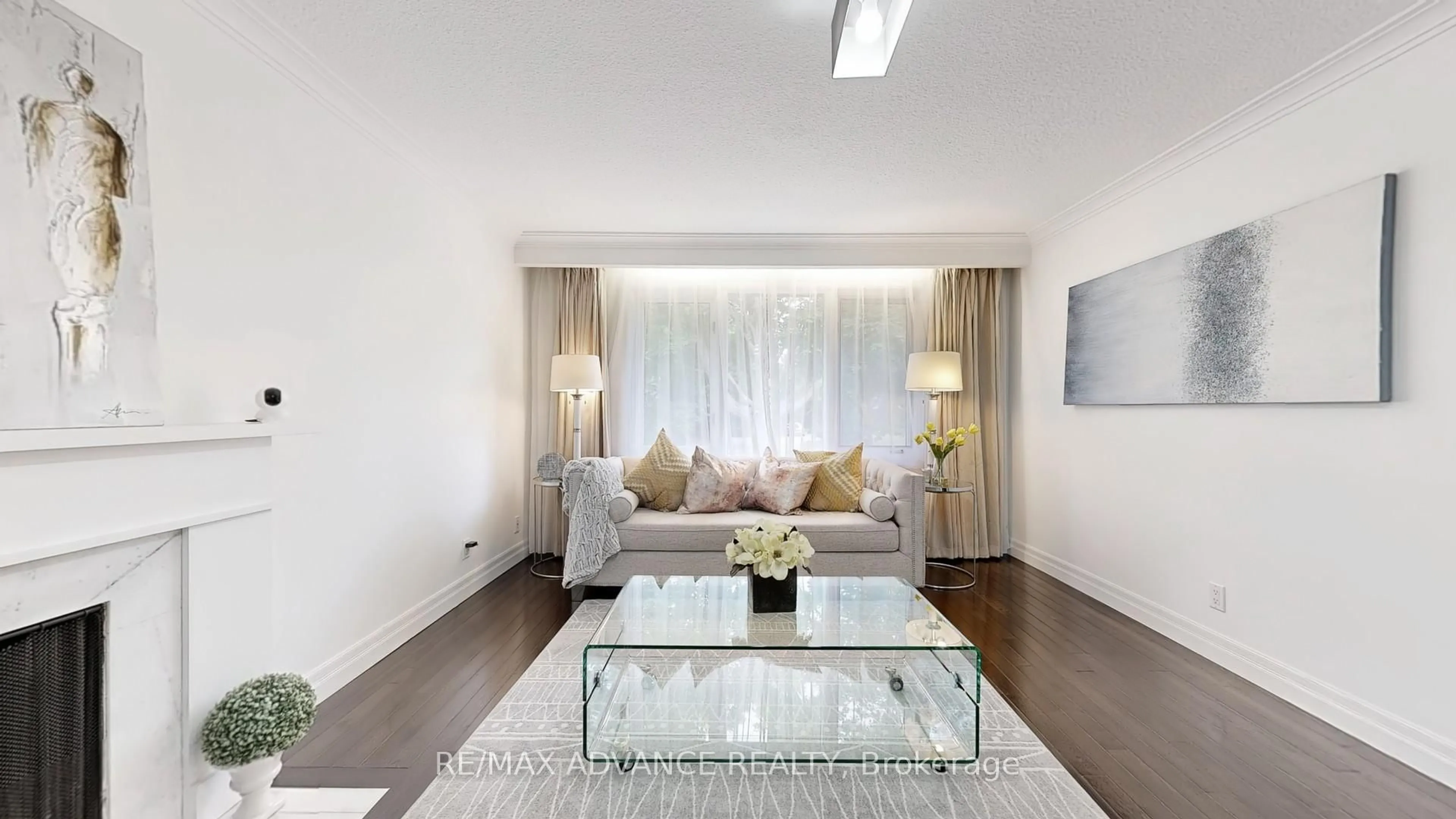 Living room with furniture, wood/laminate floor for 9 carluke Cres, Toronto Ontario M2L 2H7