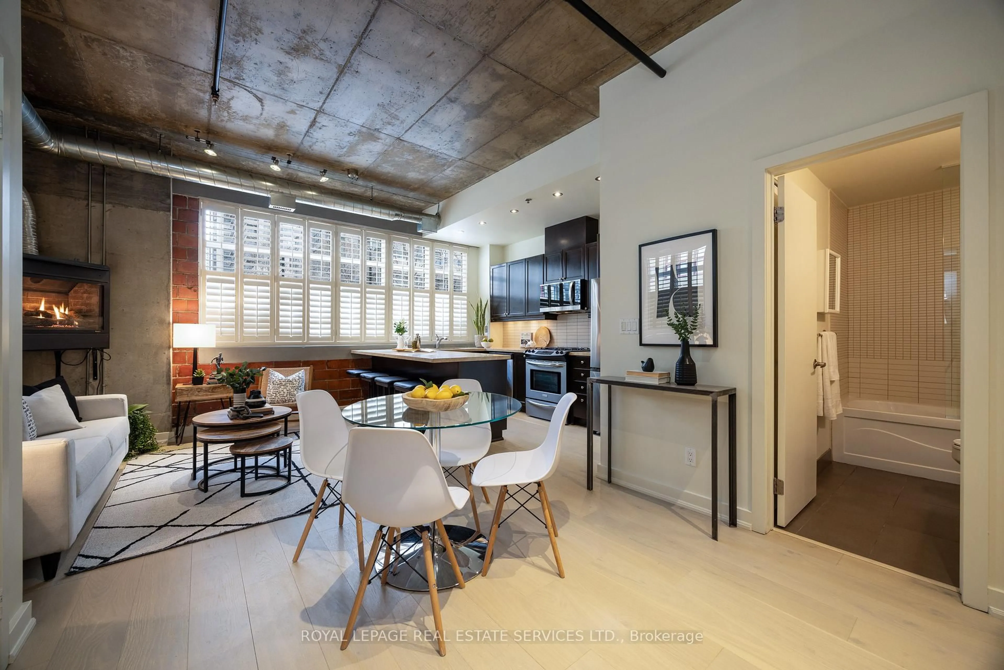 Open concept kitchen, cement floor for 10 Wellesley Pl #101, Toronto Ontario M4Y 1B1