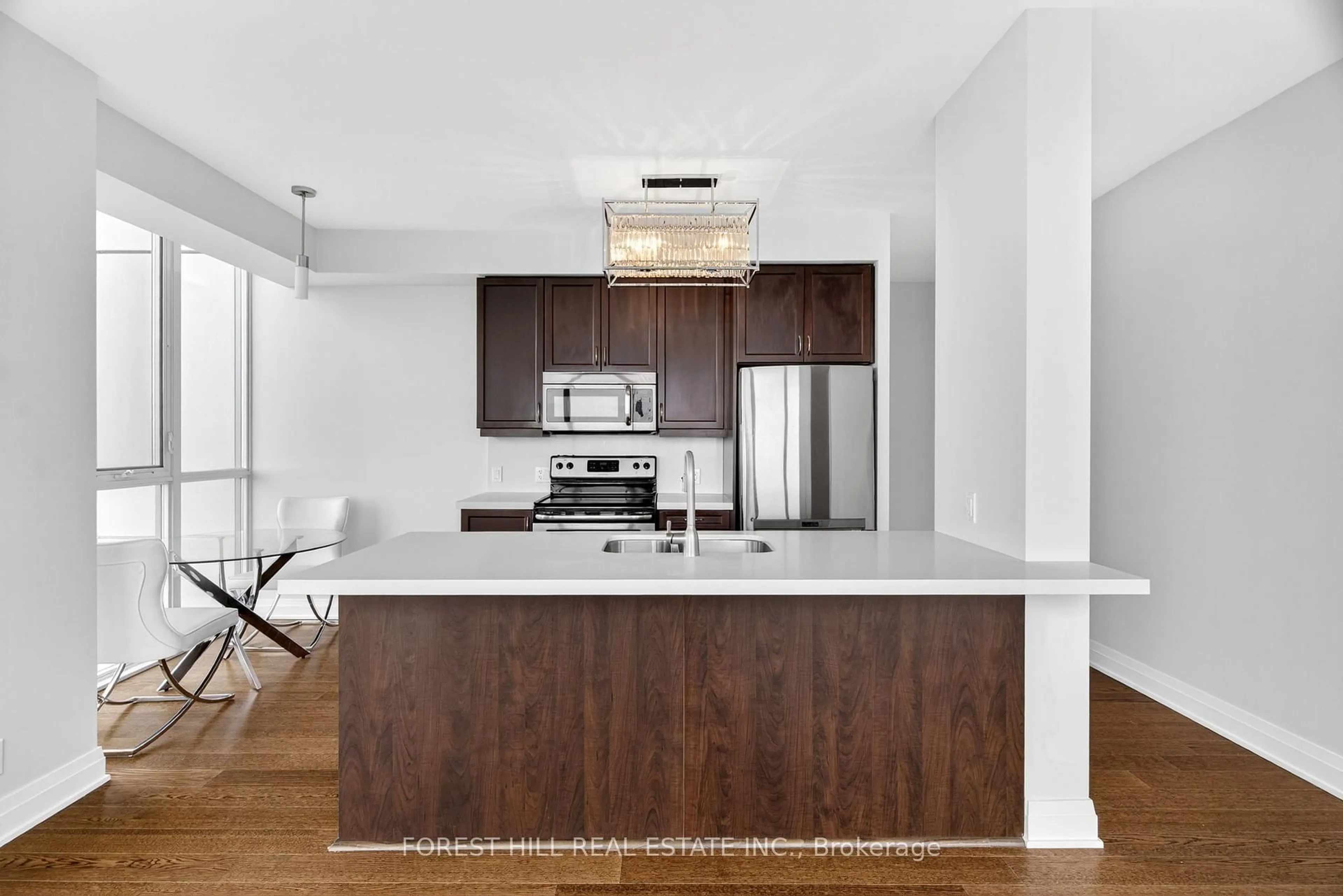 Open concept kitchen, wood/laminate floor for 530 St Clair Ave #1608, Toronto Ontario M6C 0A2