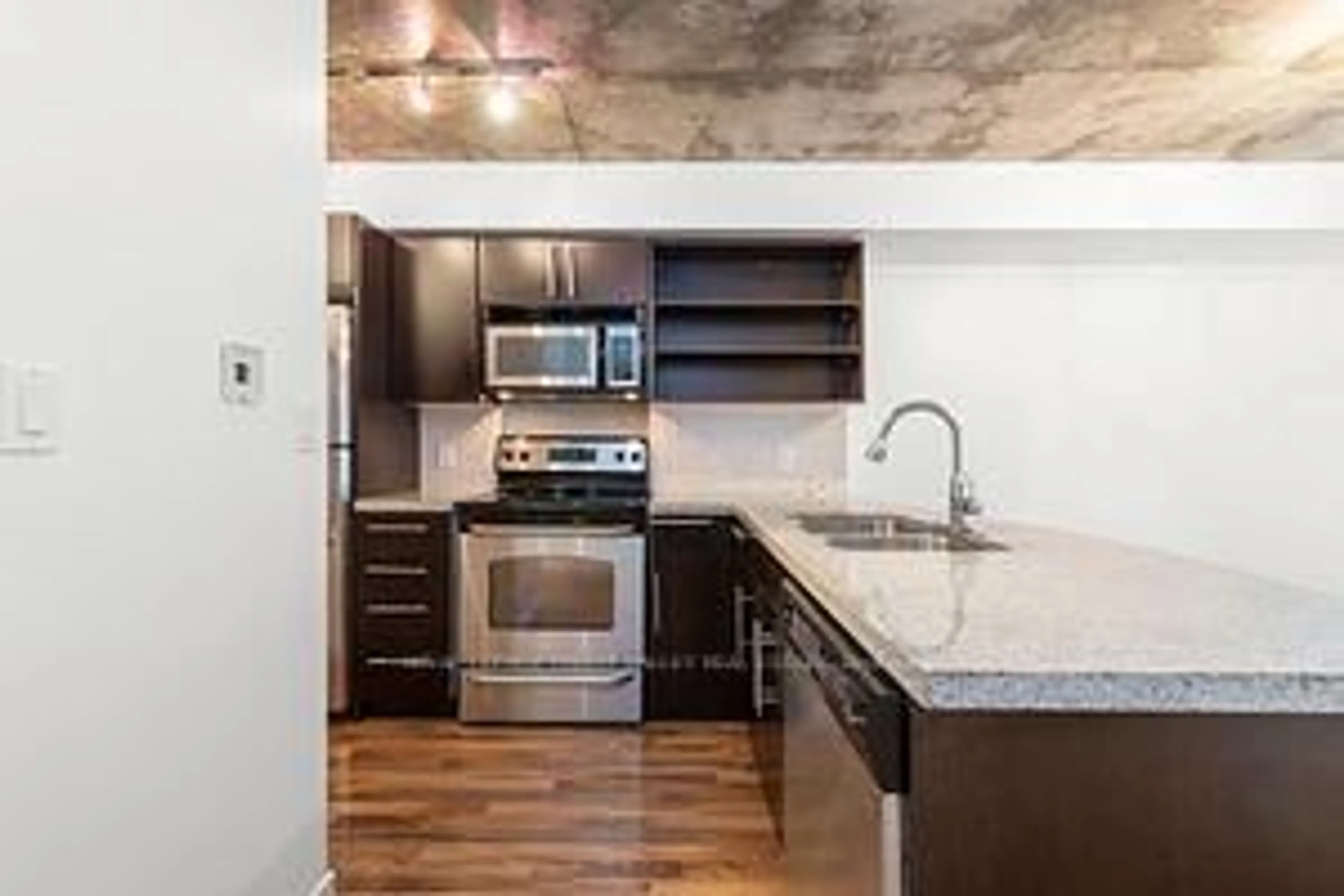 Standard kitchen, cement floor for 1005 King St #505, Toronto Ontario M6K 3M8